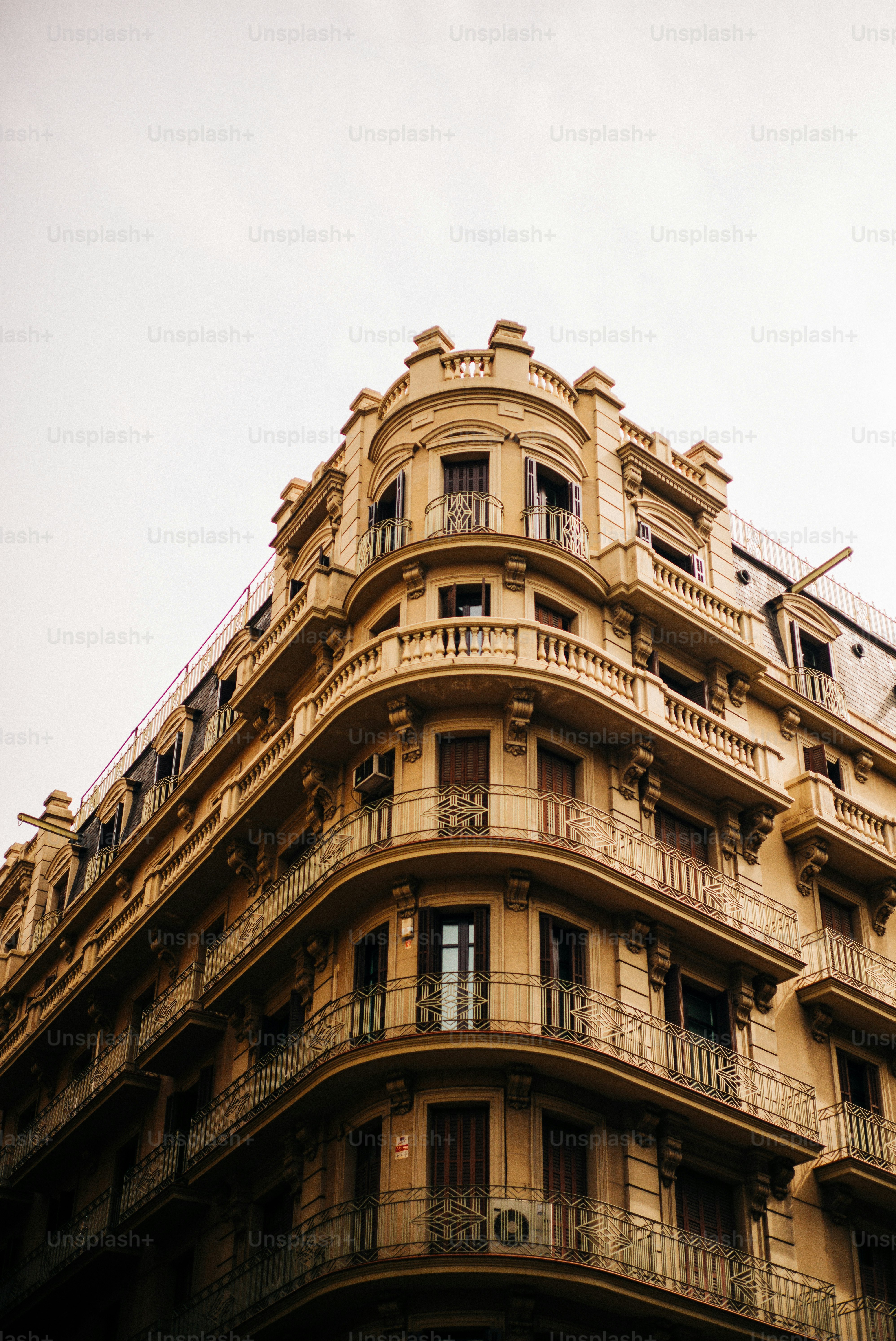 A tall building with balconies and balconies on top