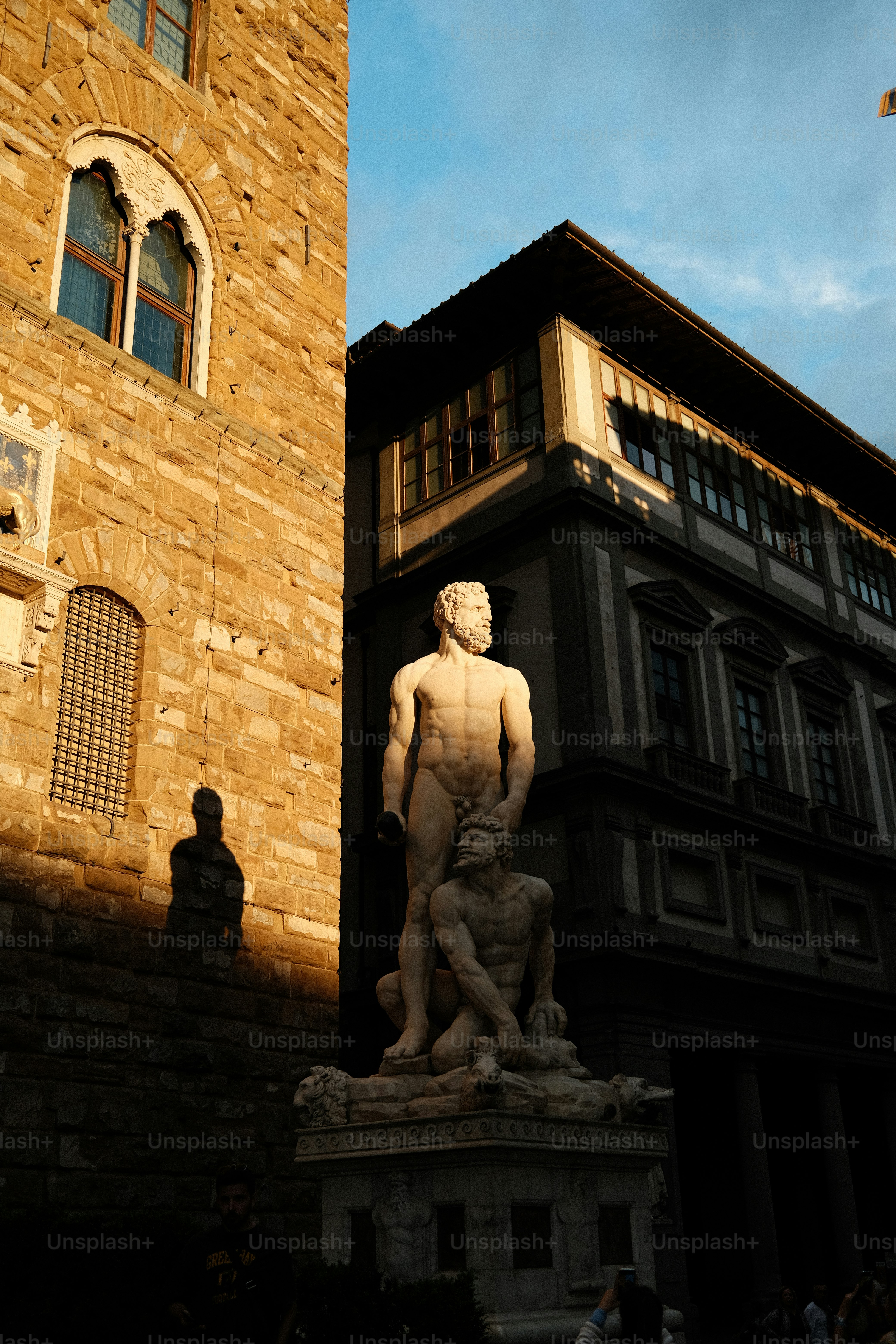 A statue of a man in front of a building