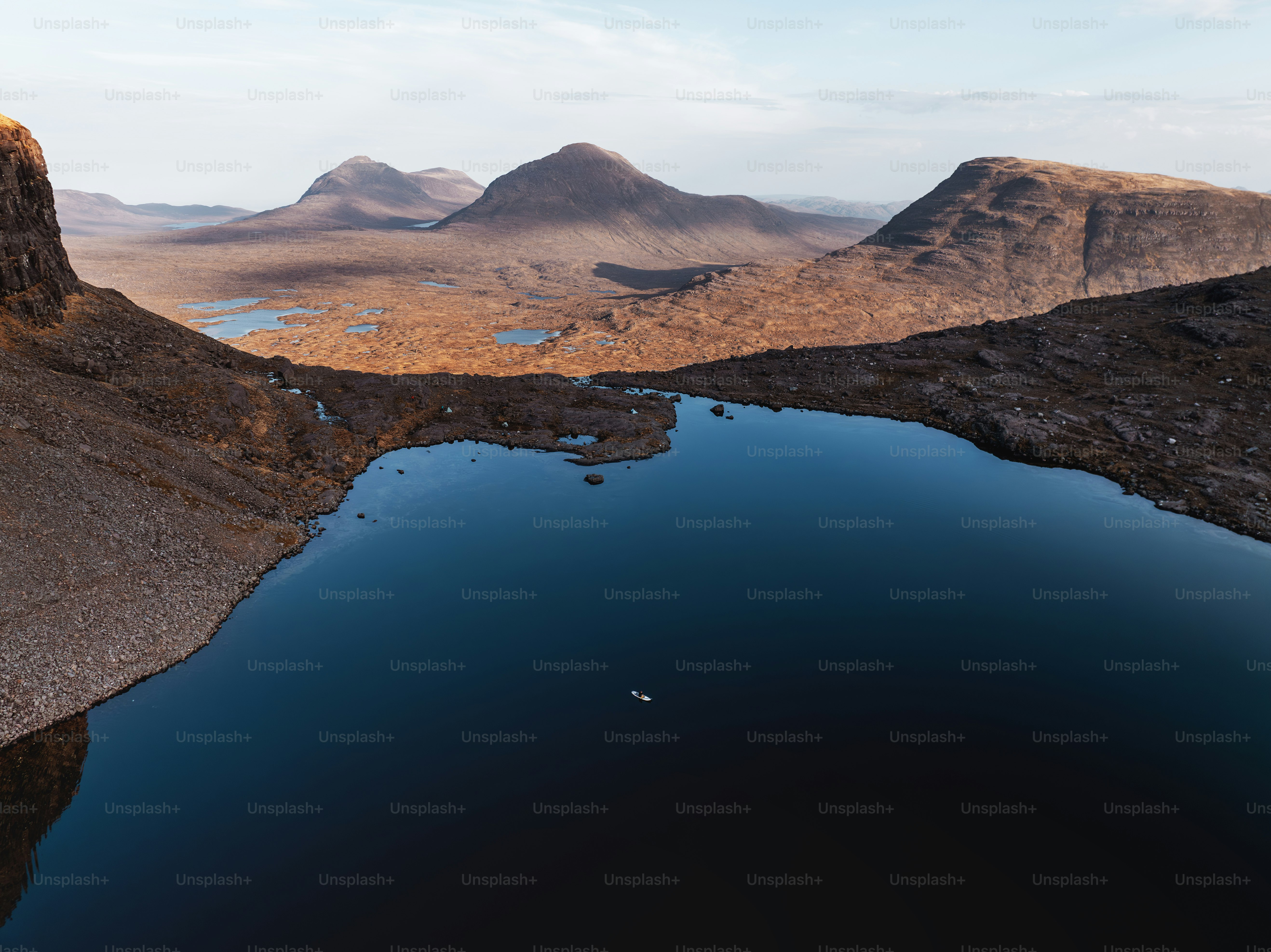 A large body of water surrounded by mountains