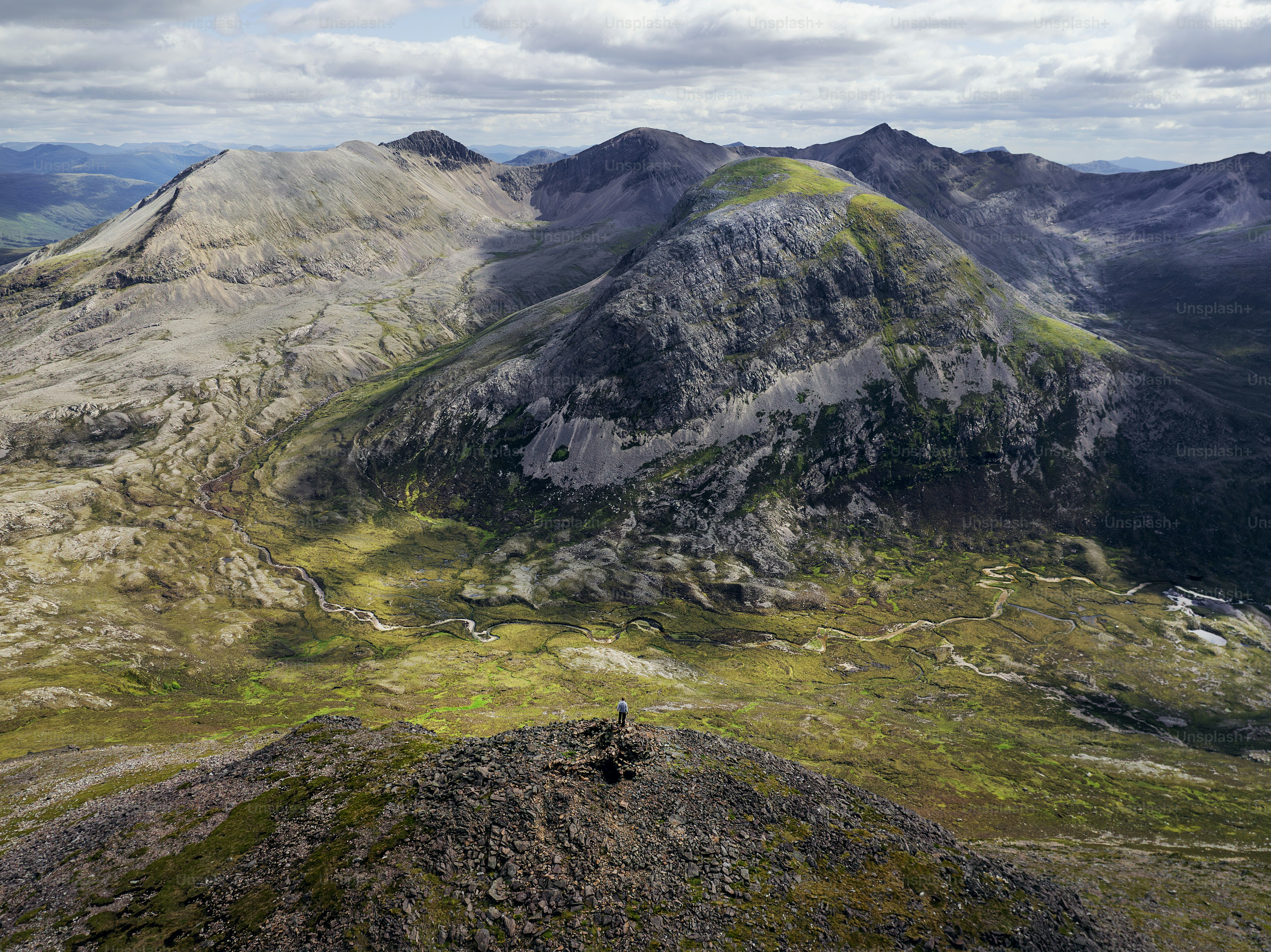 A view of a mountain range from the top of a mountain