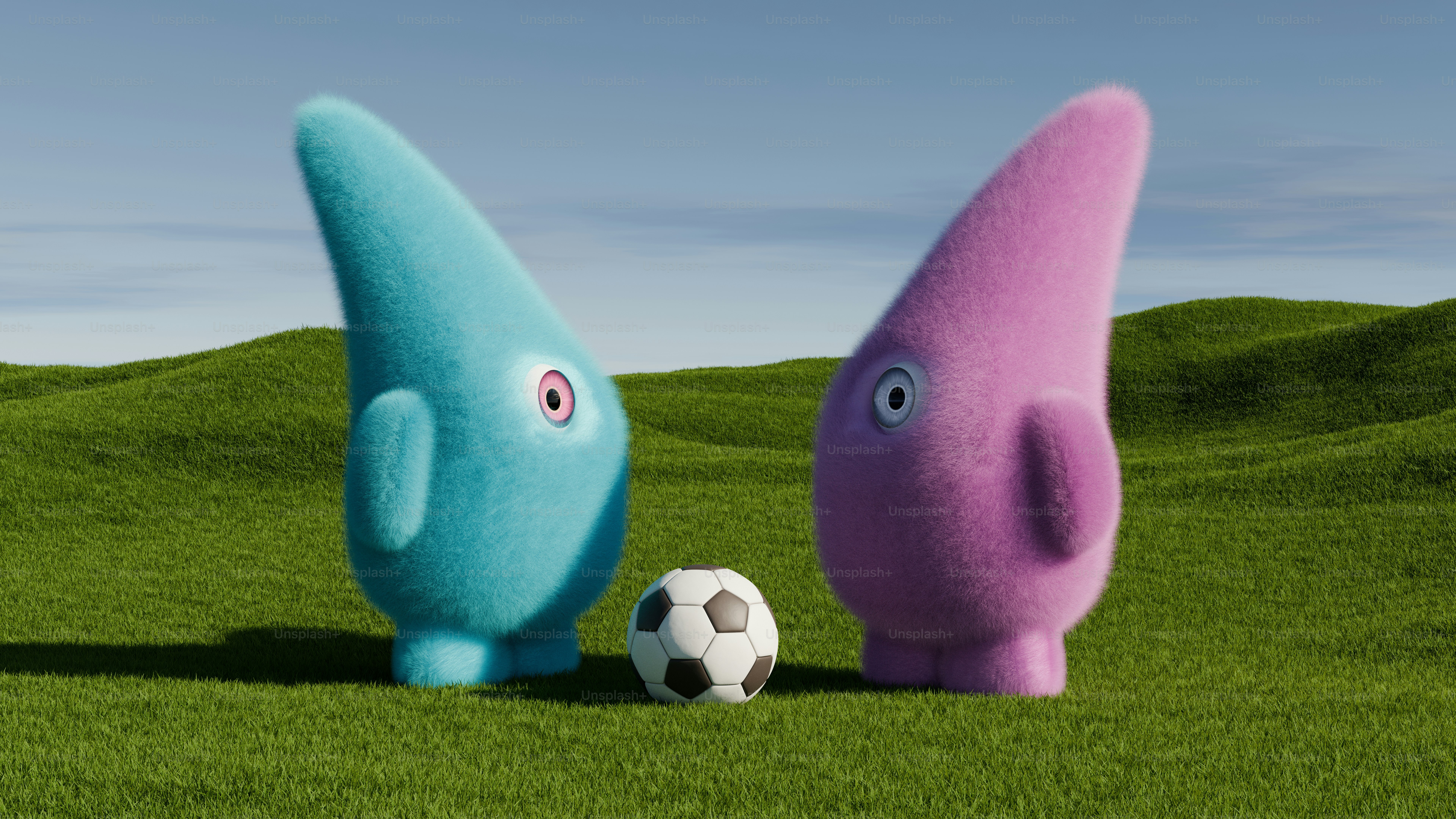 A couple of very cute looking animals in a field