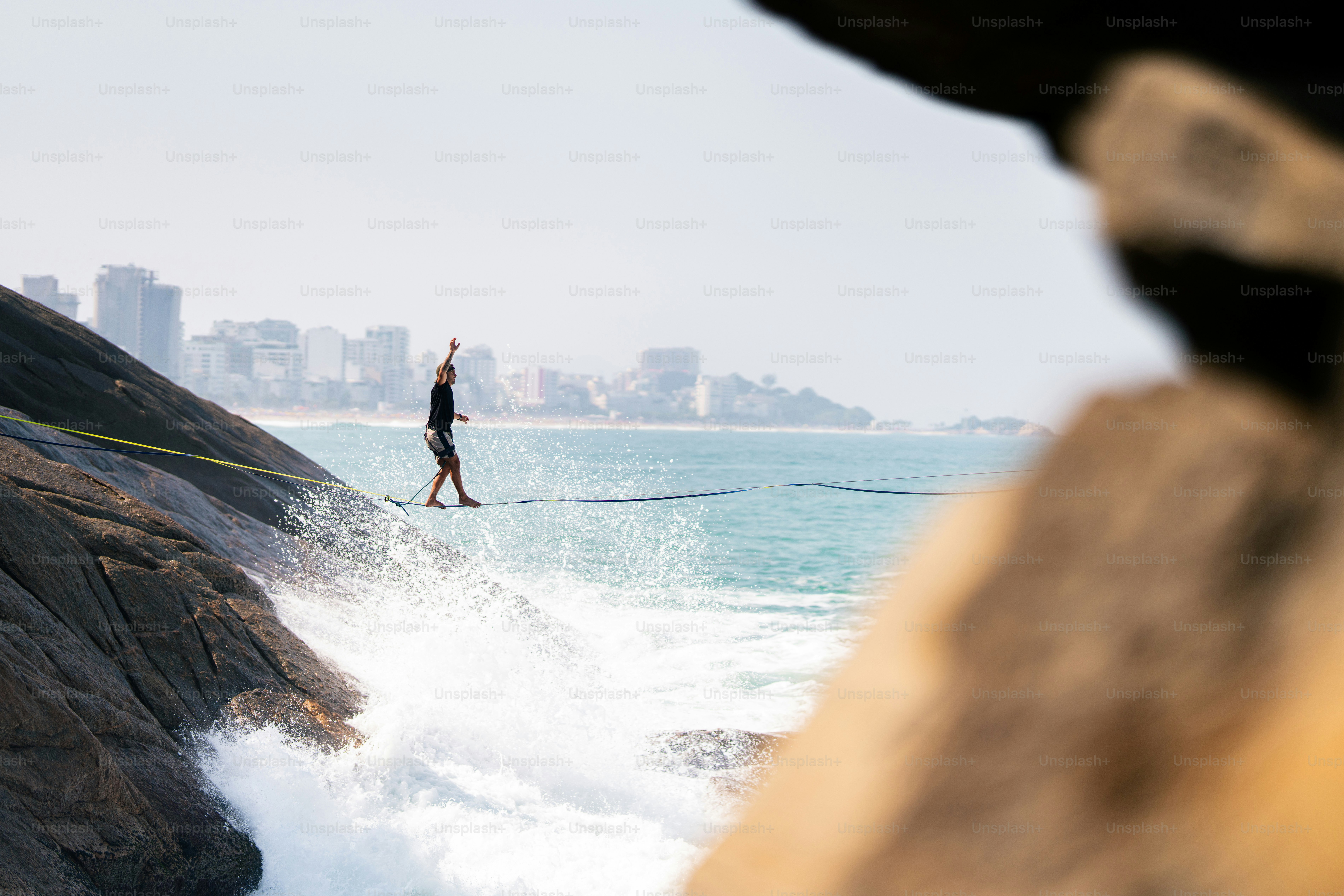 A person riding a board on top of a wave