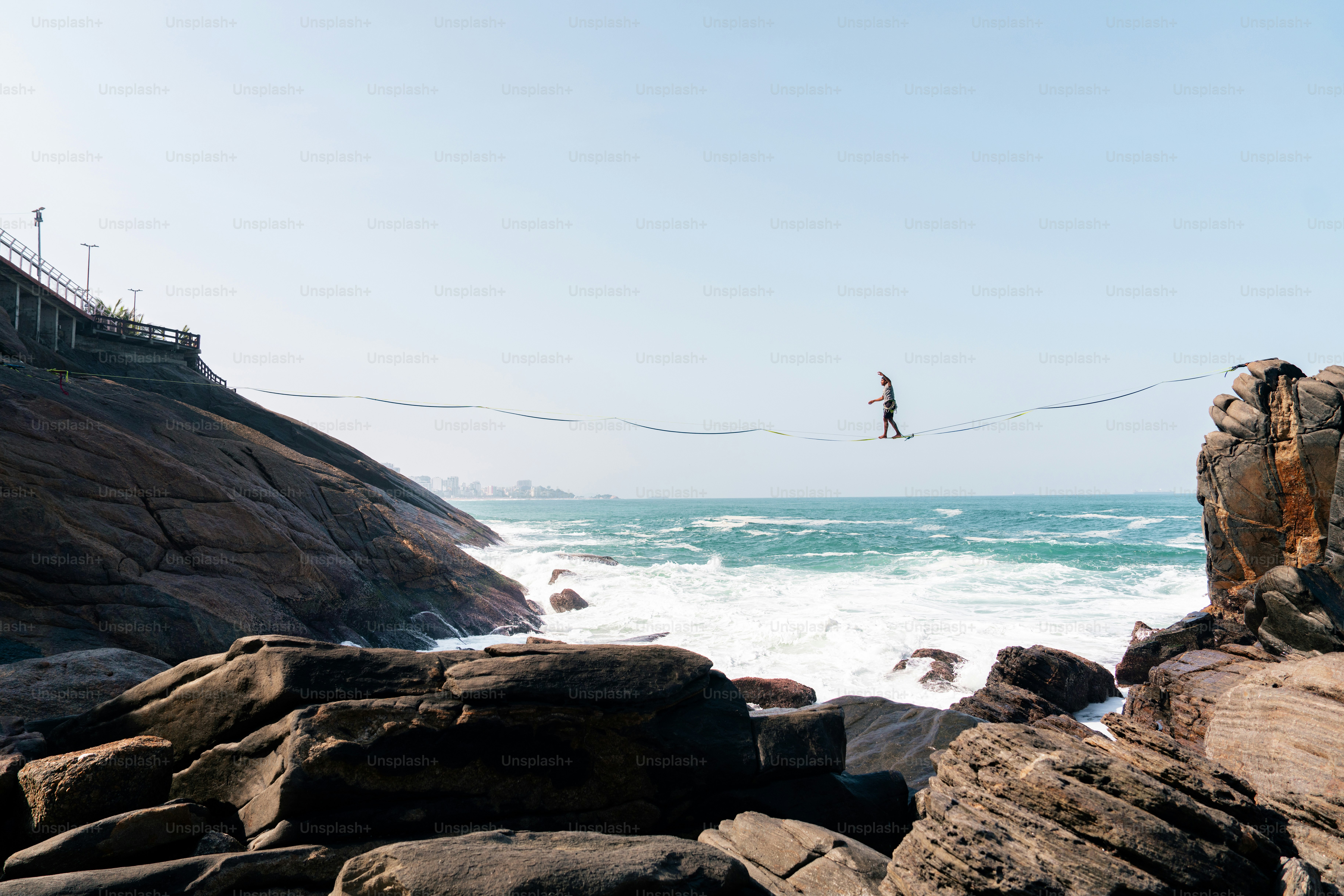 A person is parasailing in the ocean on a sunny day
