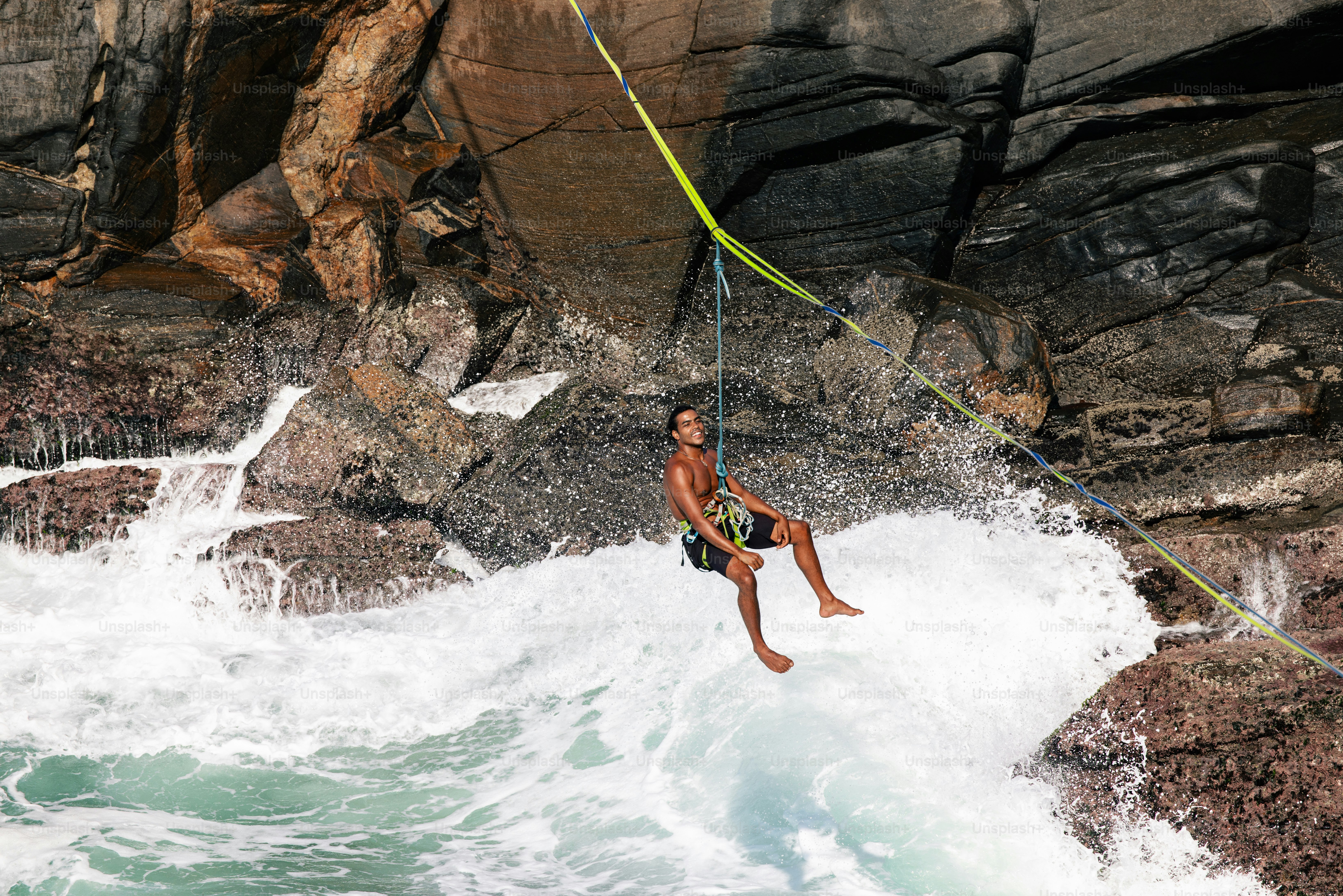 A man riding a surfboard on top of a wave