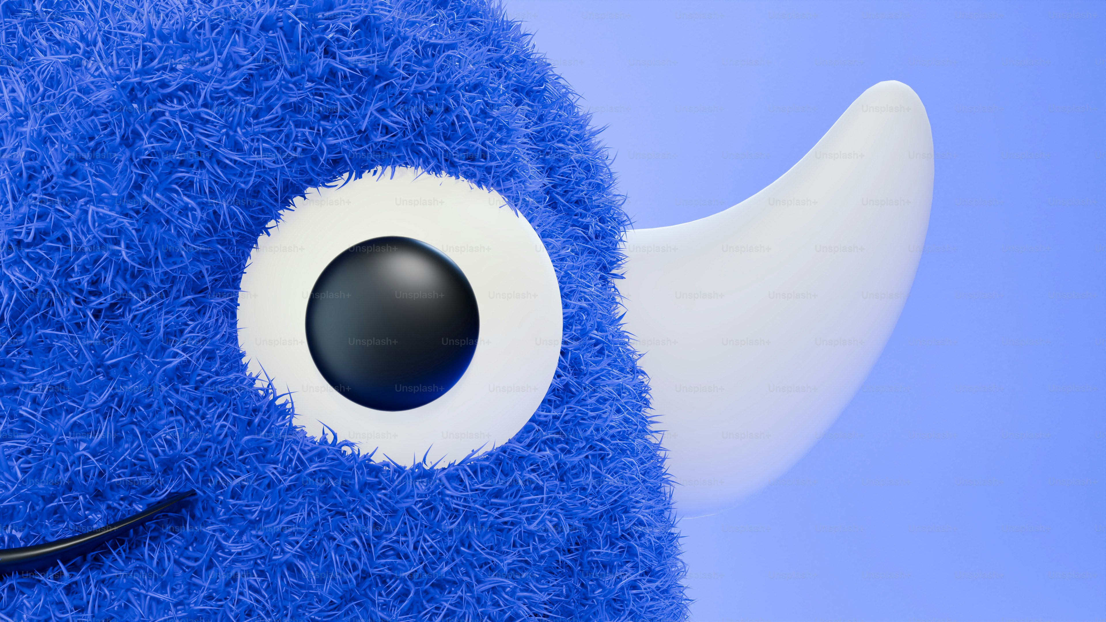 A close up of a stuffed animal with big eyes