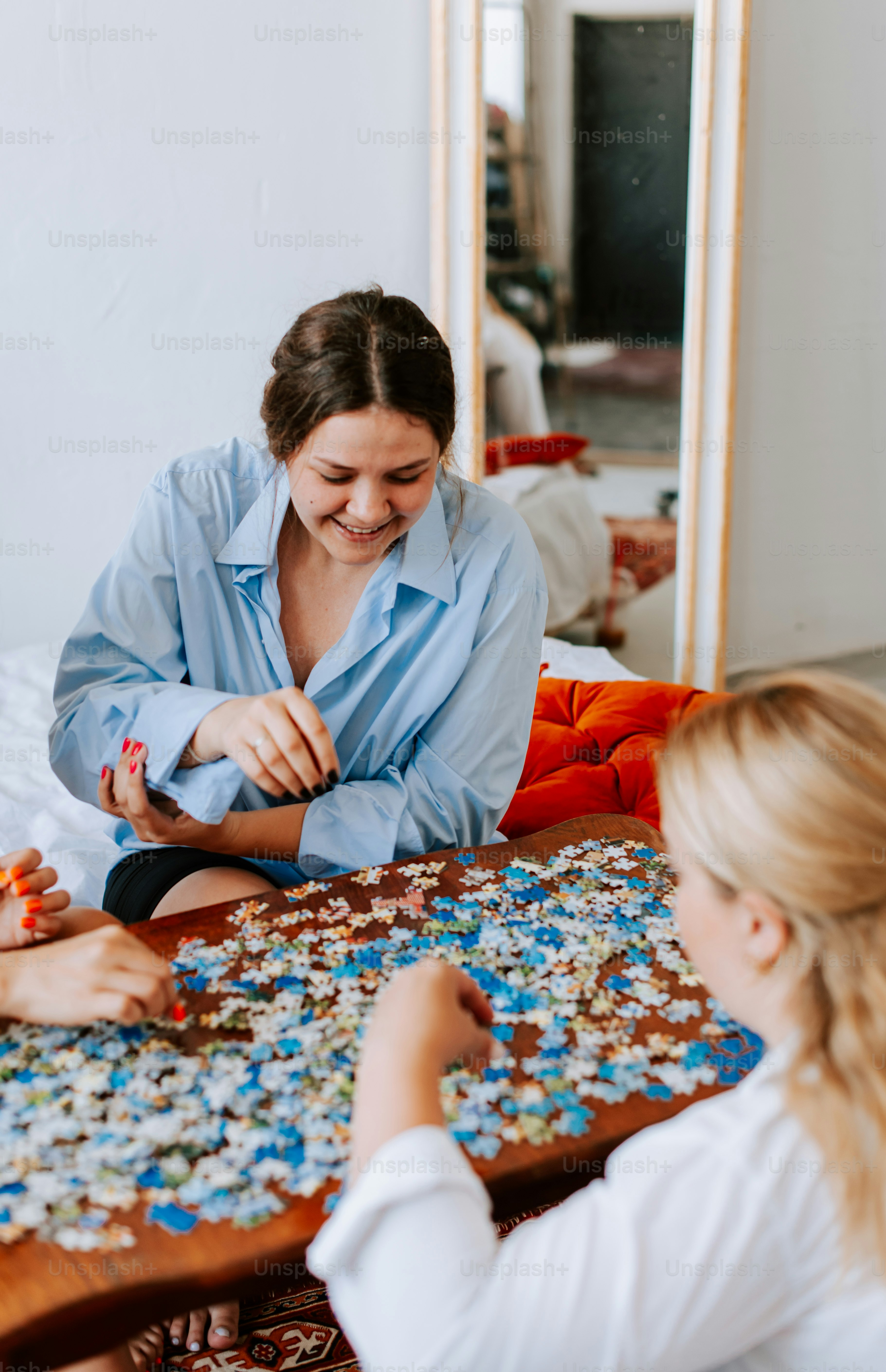 A group of women sitting around a wooden table