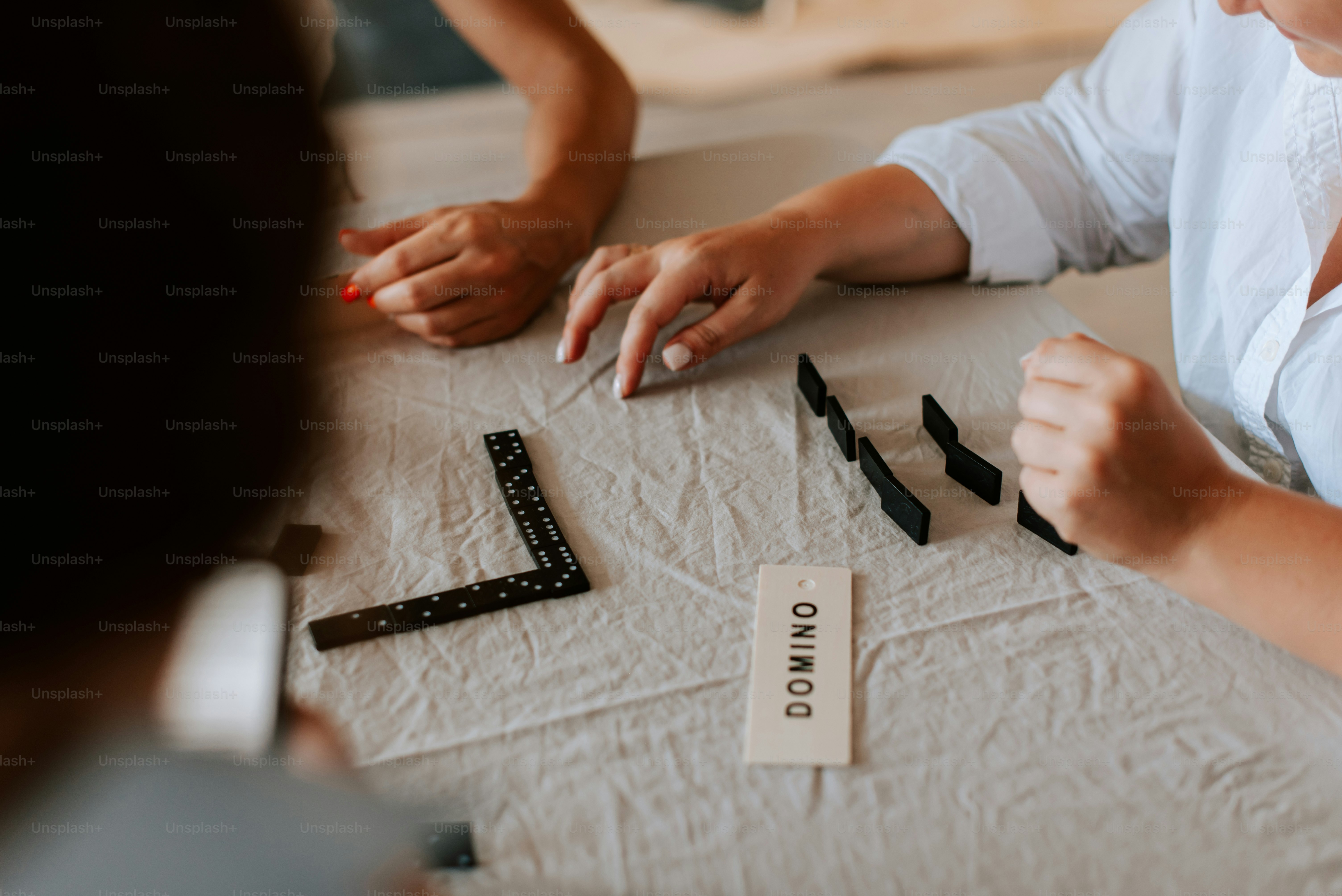 A couple of people that are sitting at a table