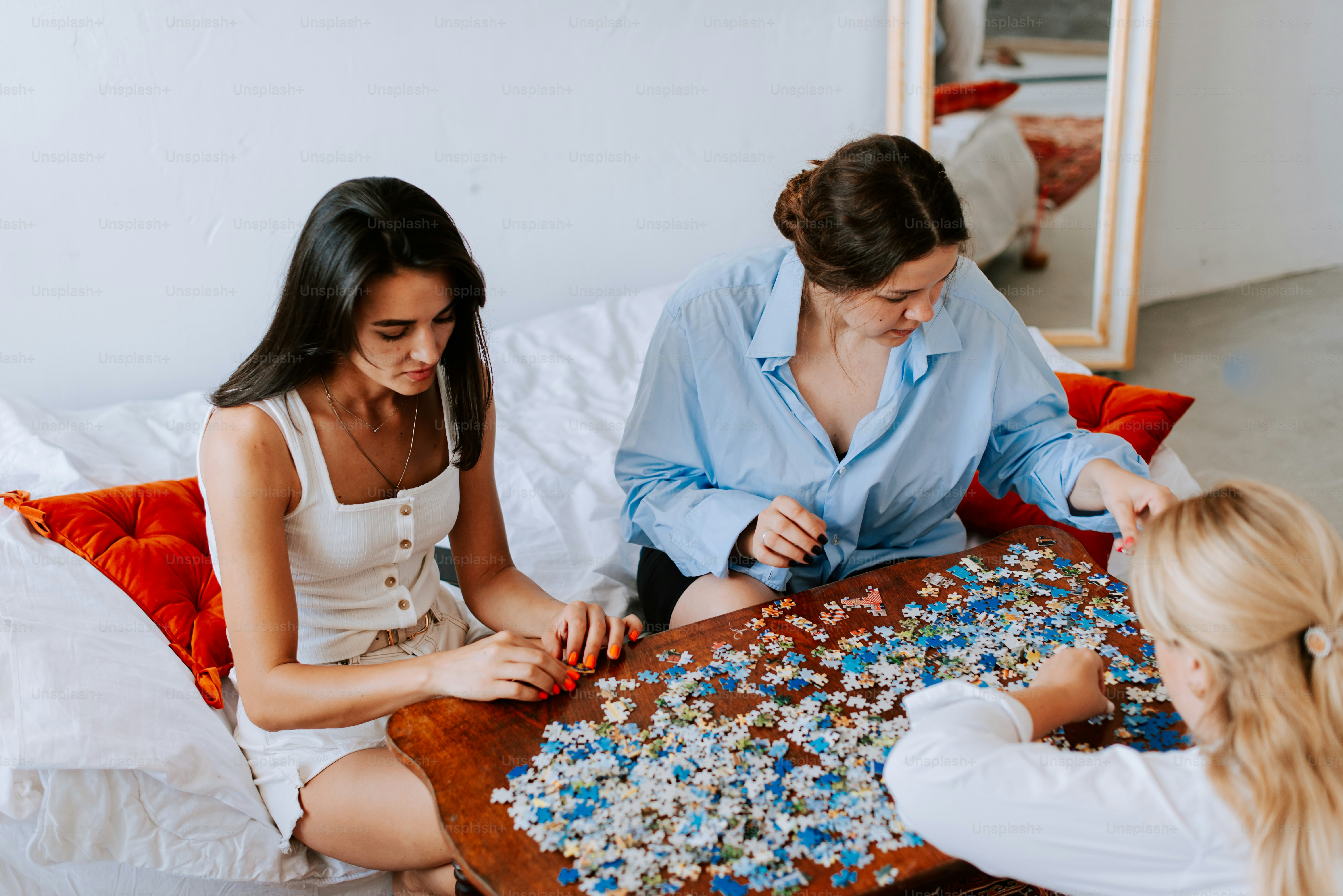 A group of women sitting around a table playing a game