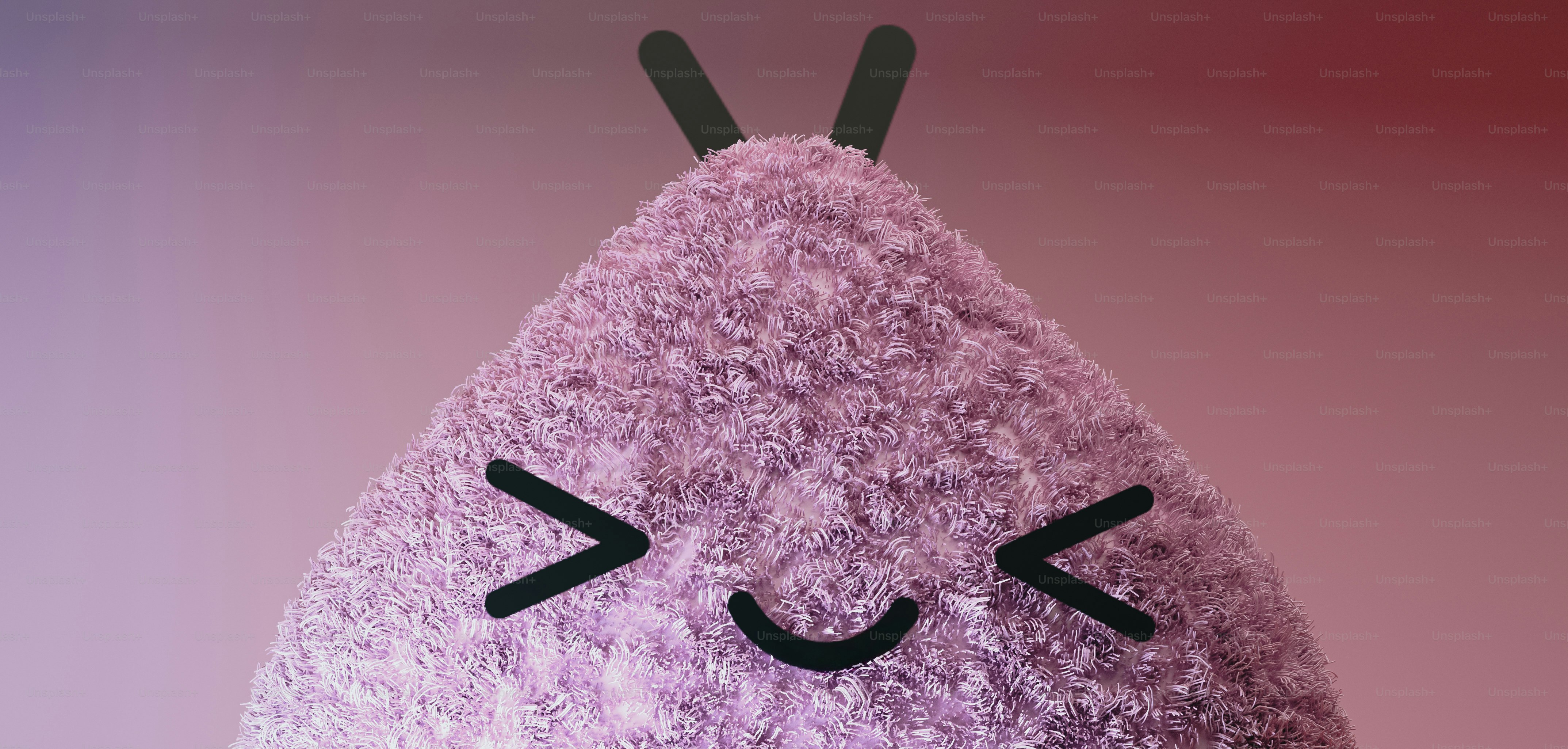 A close up of a stuffed animal on a pink background