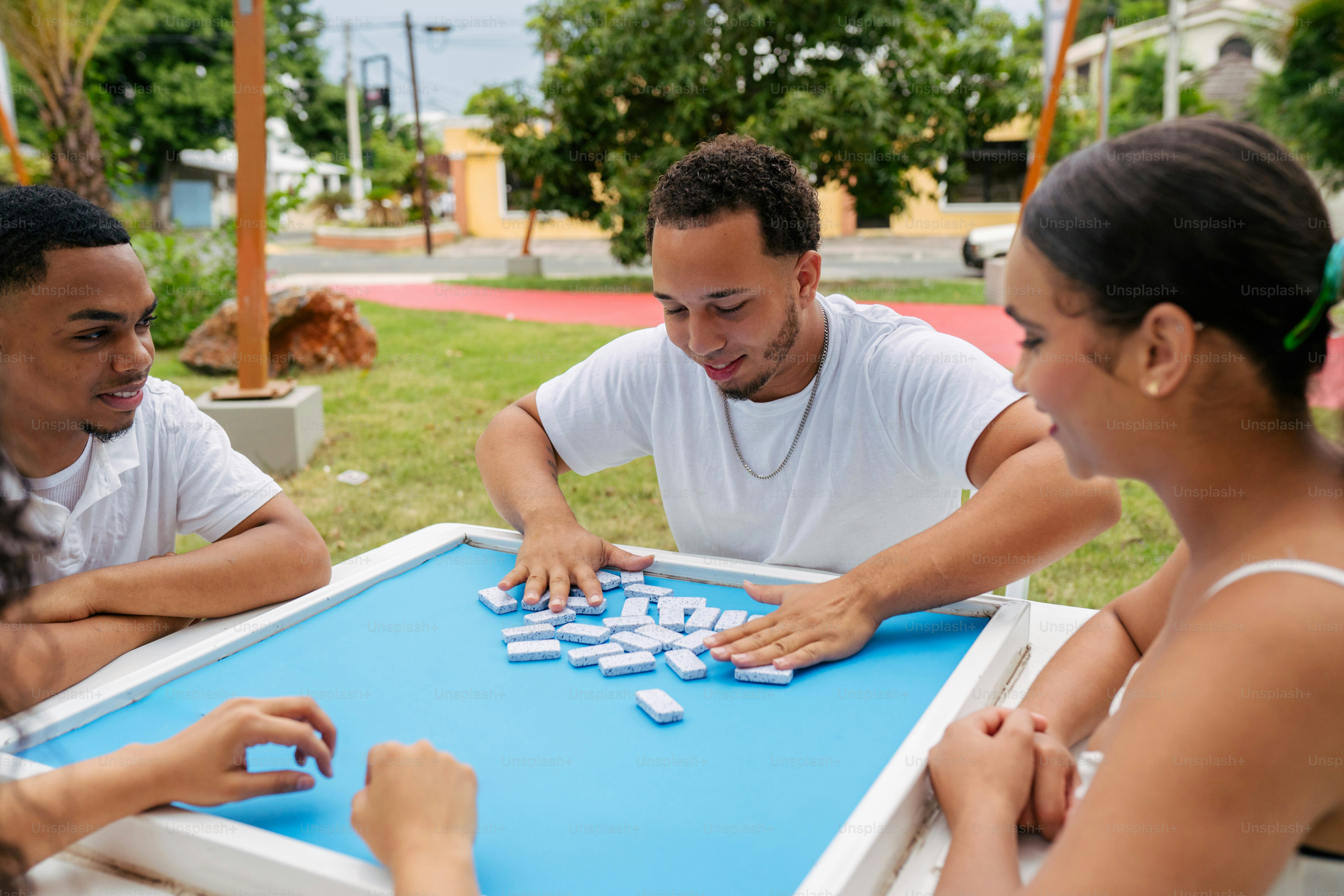 A group of people playing a game of checkers