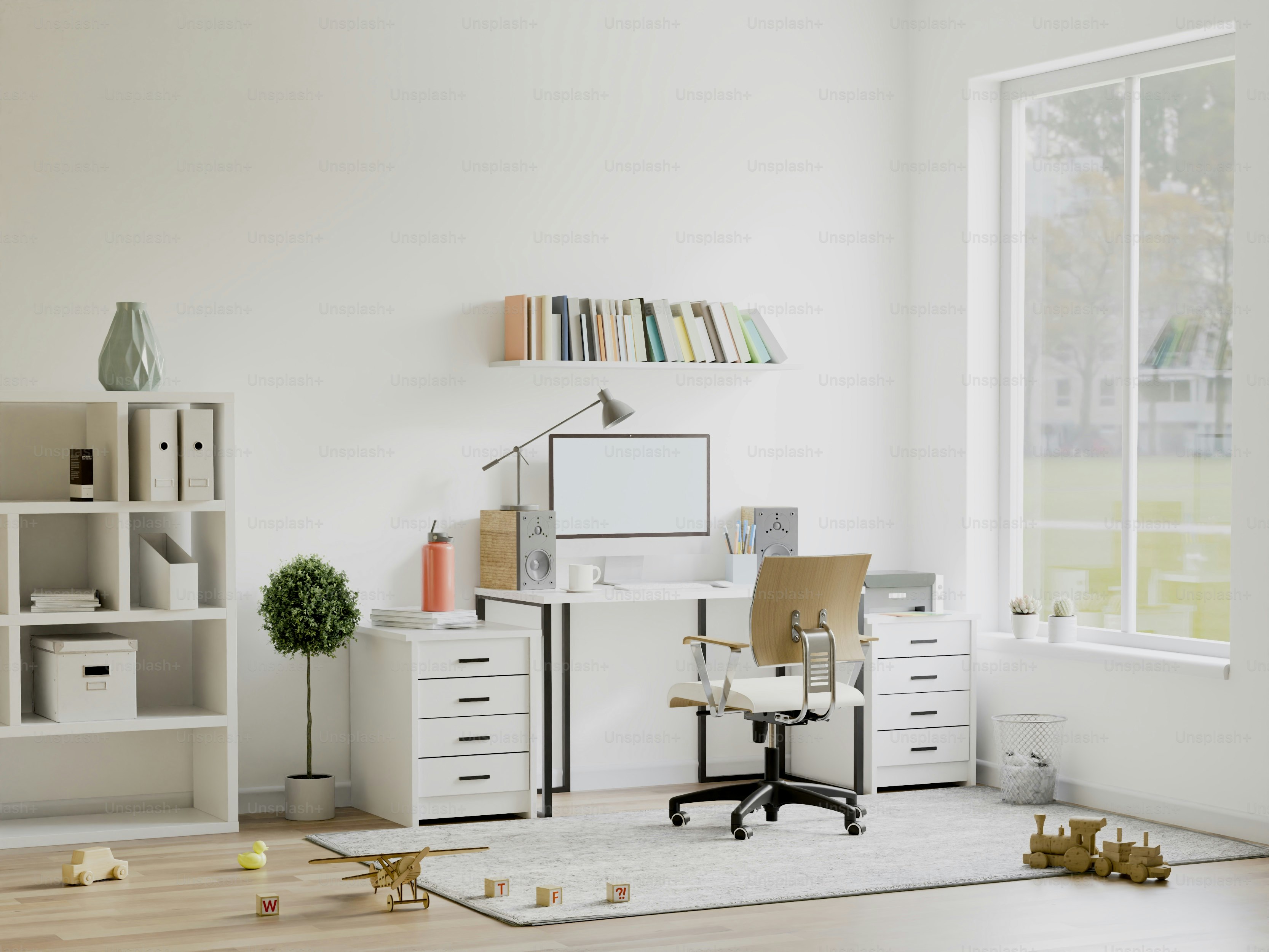 A room with a desk, chair, bookshelf and a window