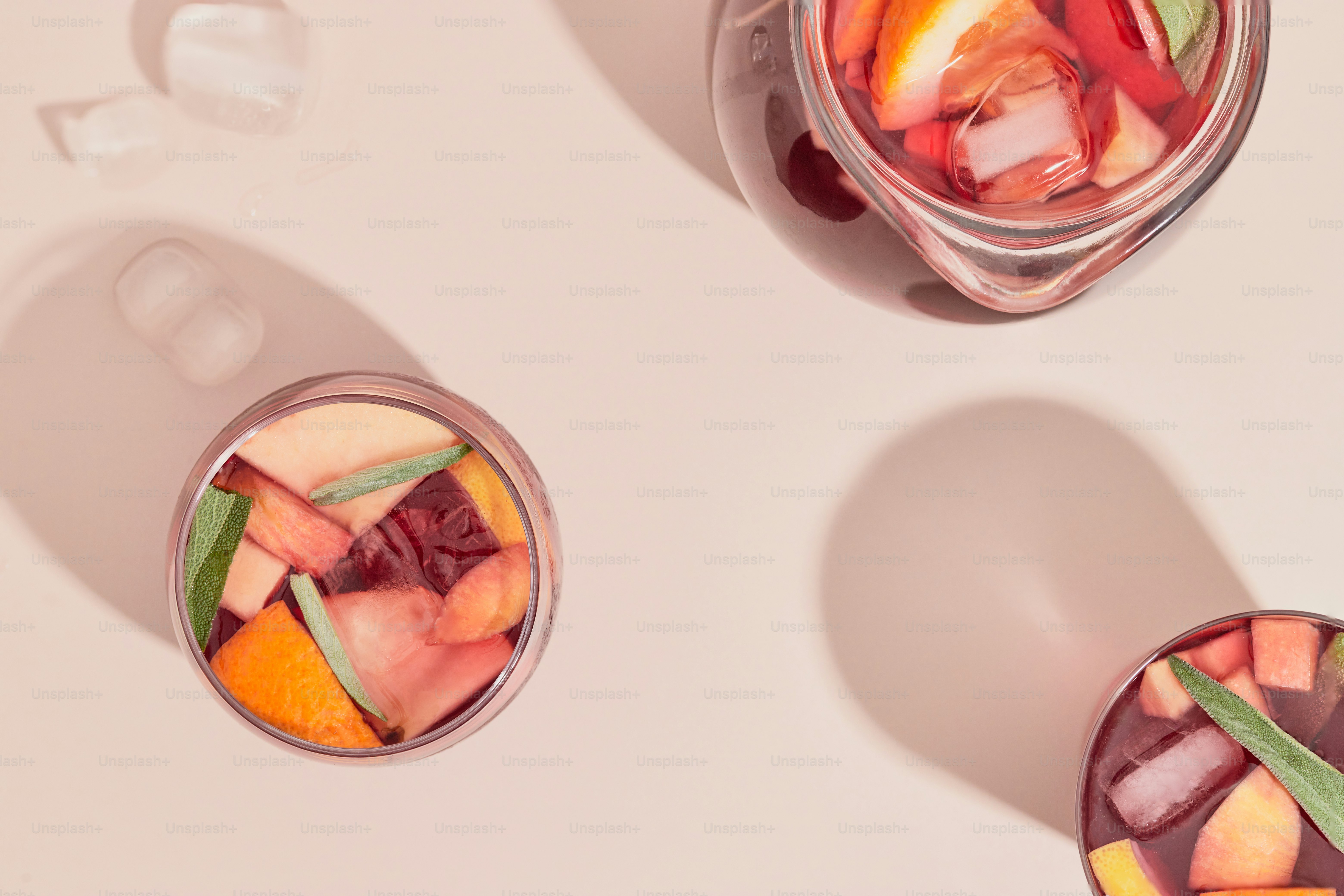 A couple of jars filled with different types of fruit