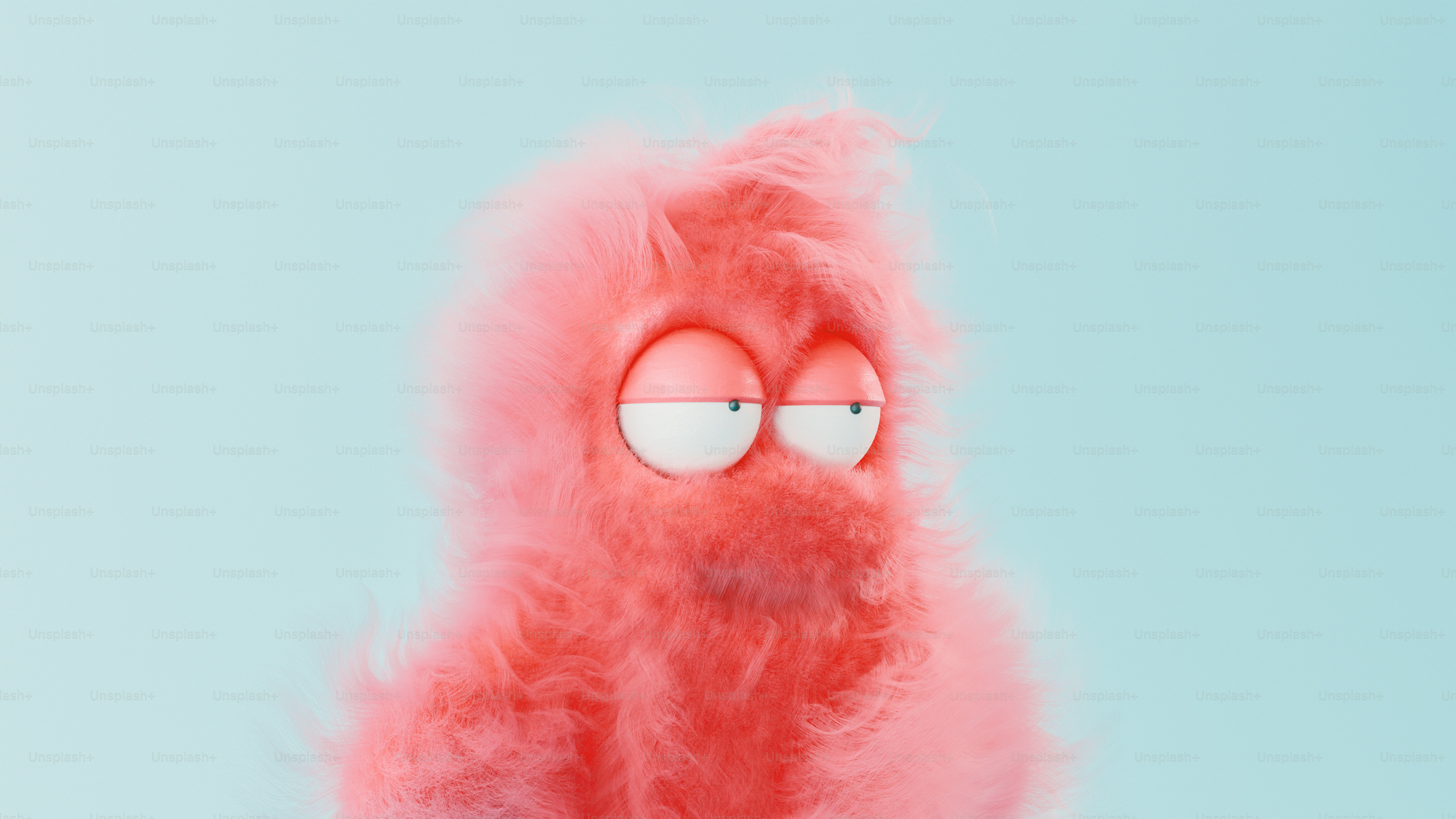 A pink stuffed animal with eyes and a nose