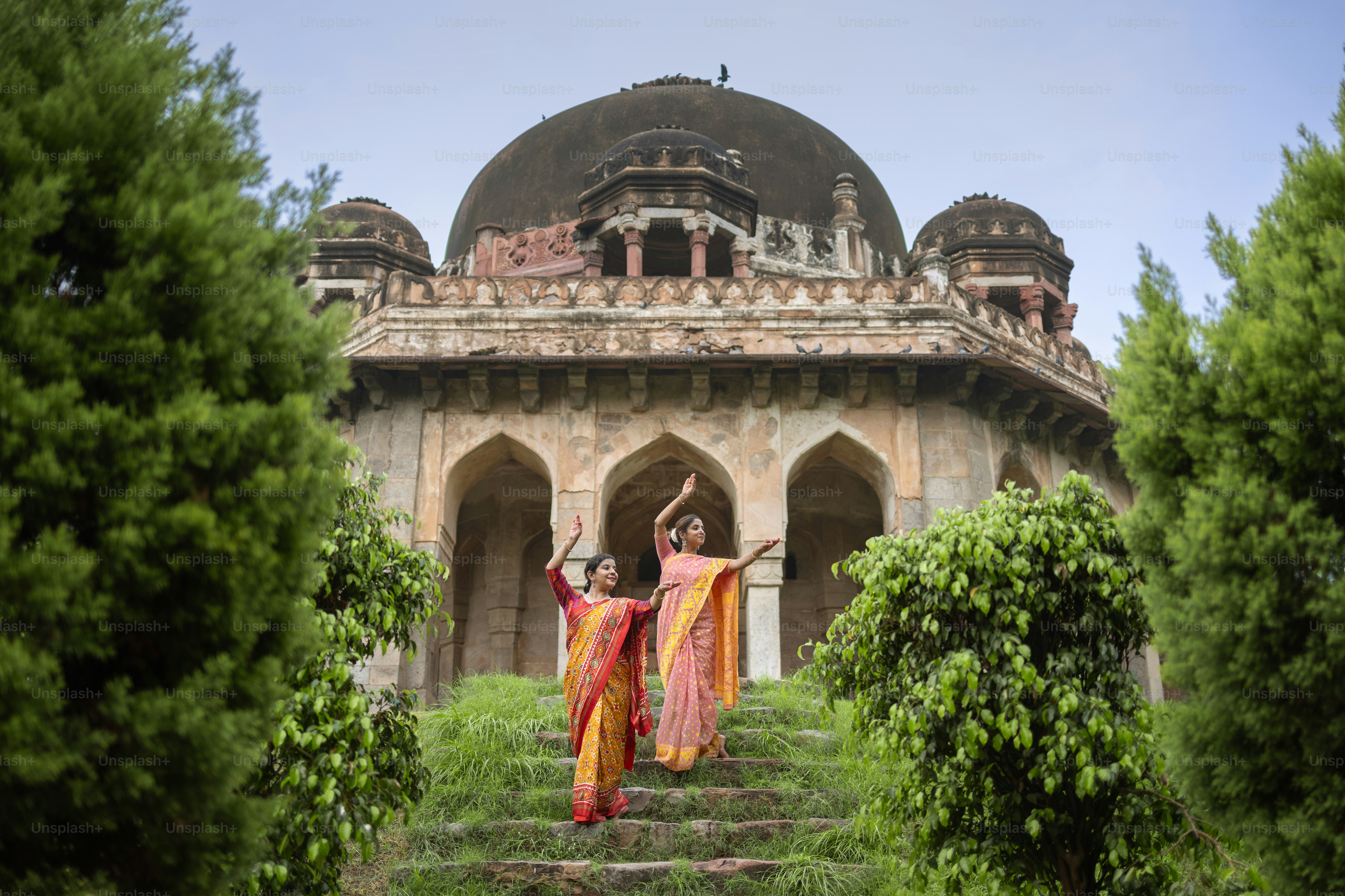 A woman standing on a set of stairs in front of a building