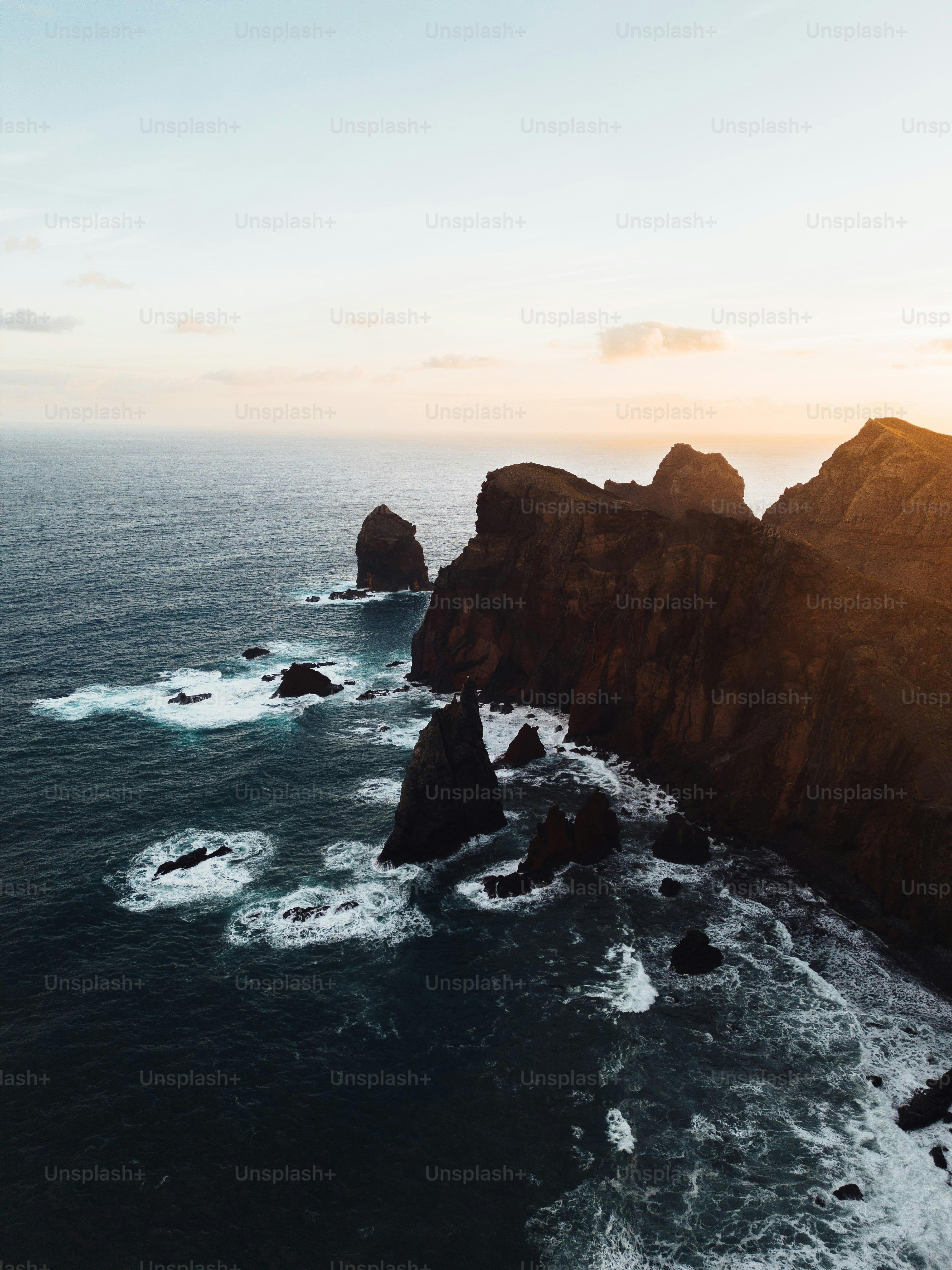 A large body of water next to a rocky shore