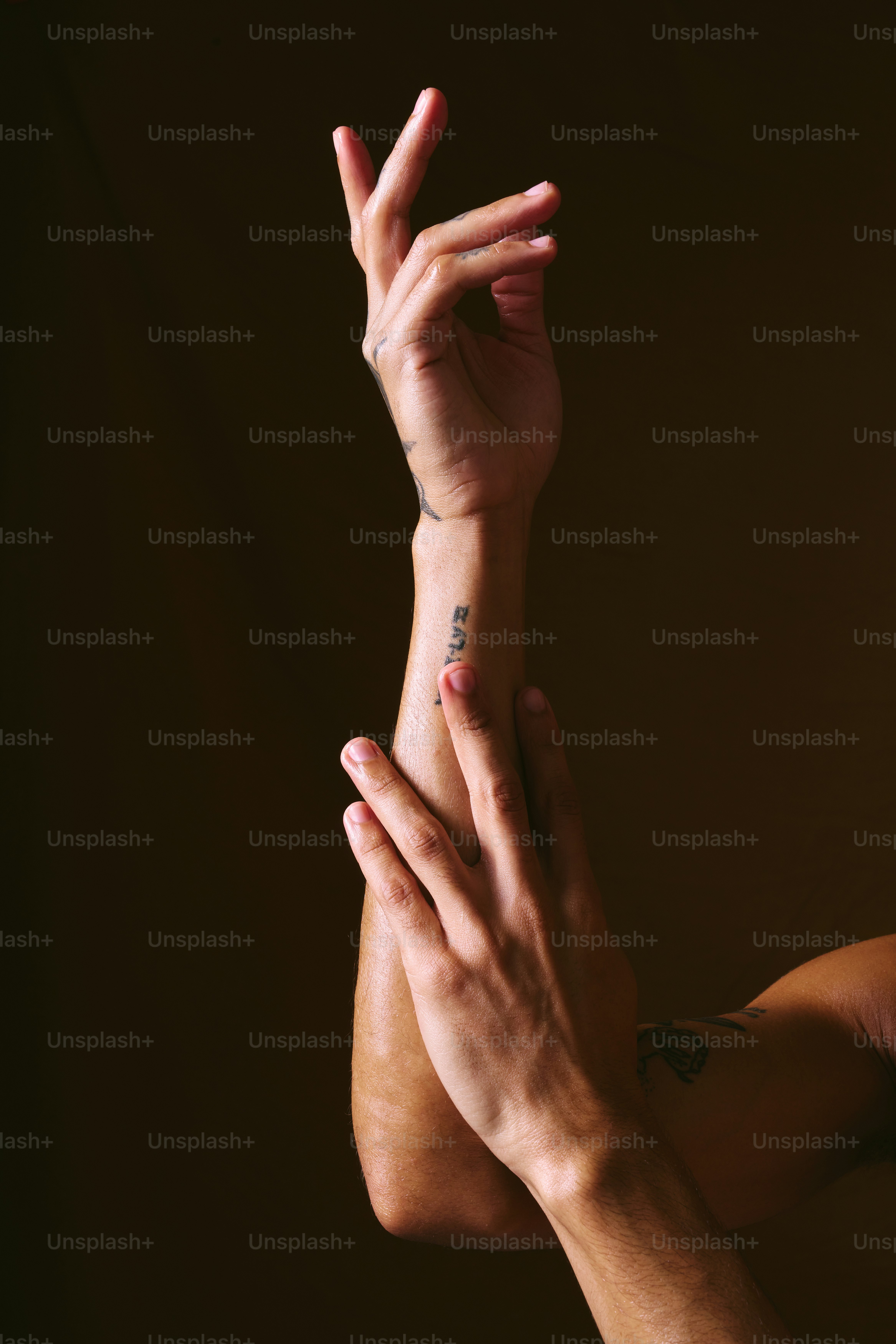 A woman with her hands up in the air