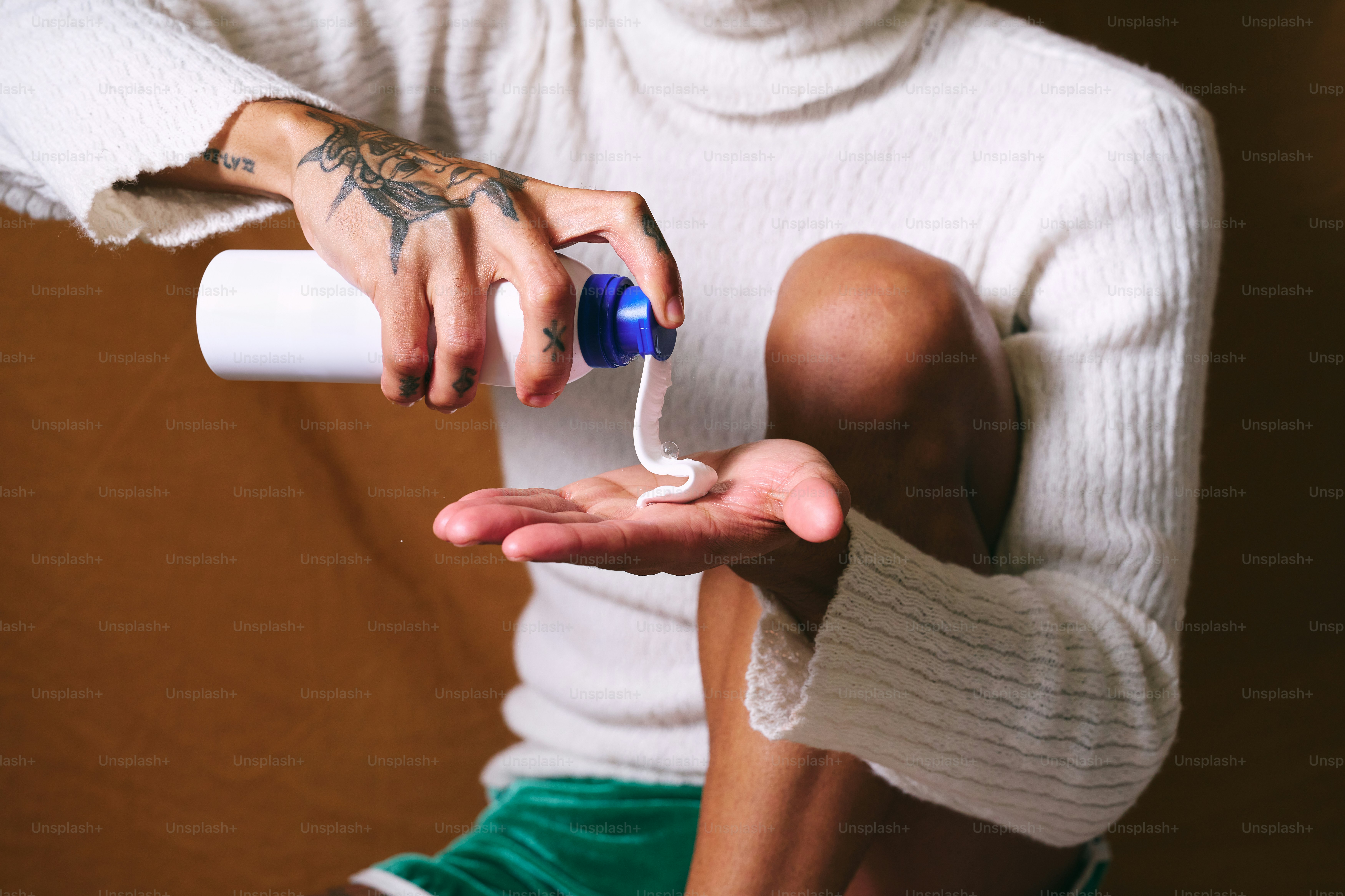 A person holding a wii remote in their hand