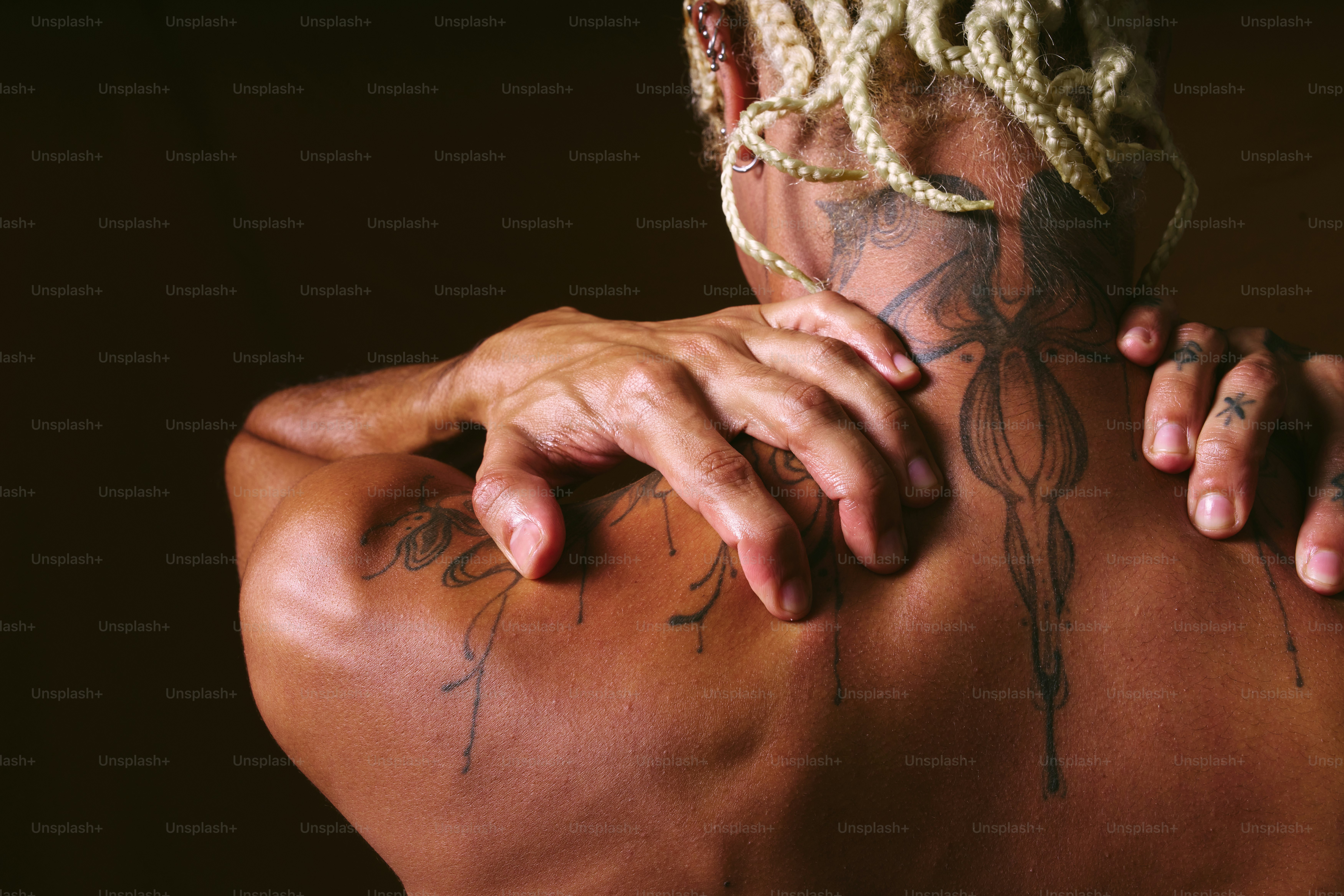 A man with a tattoo on his back