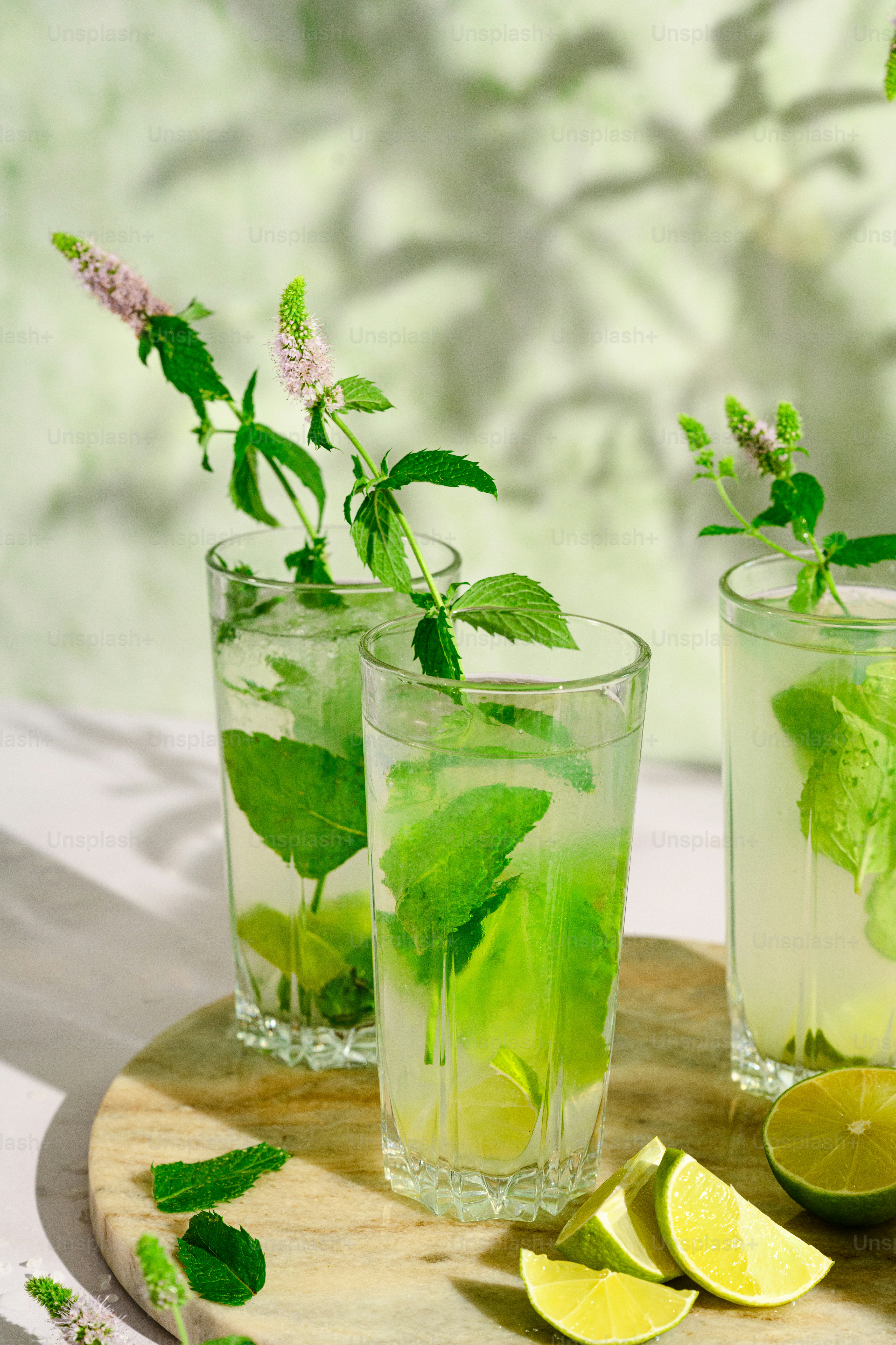 Three glasses of green tea with mint and lemon
