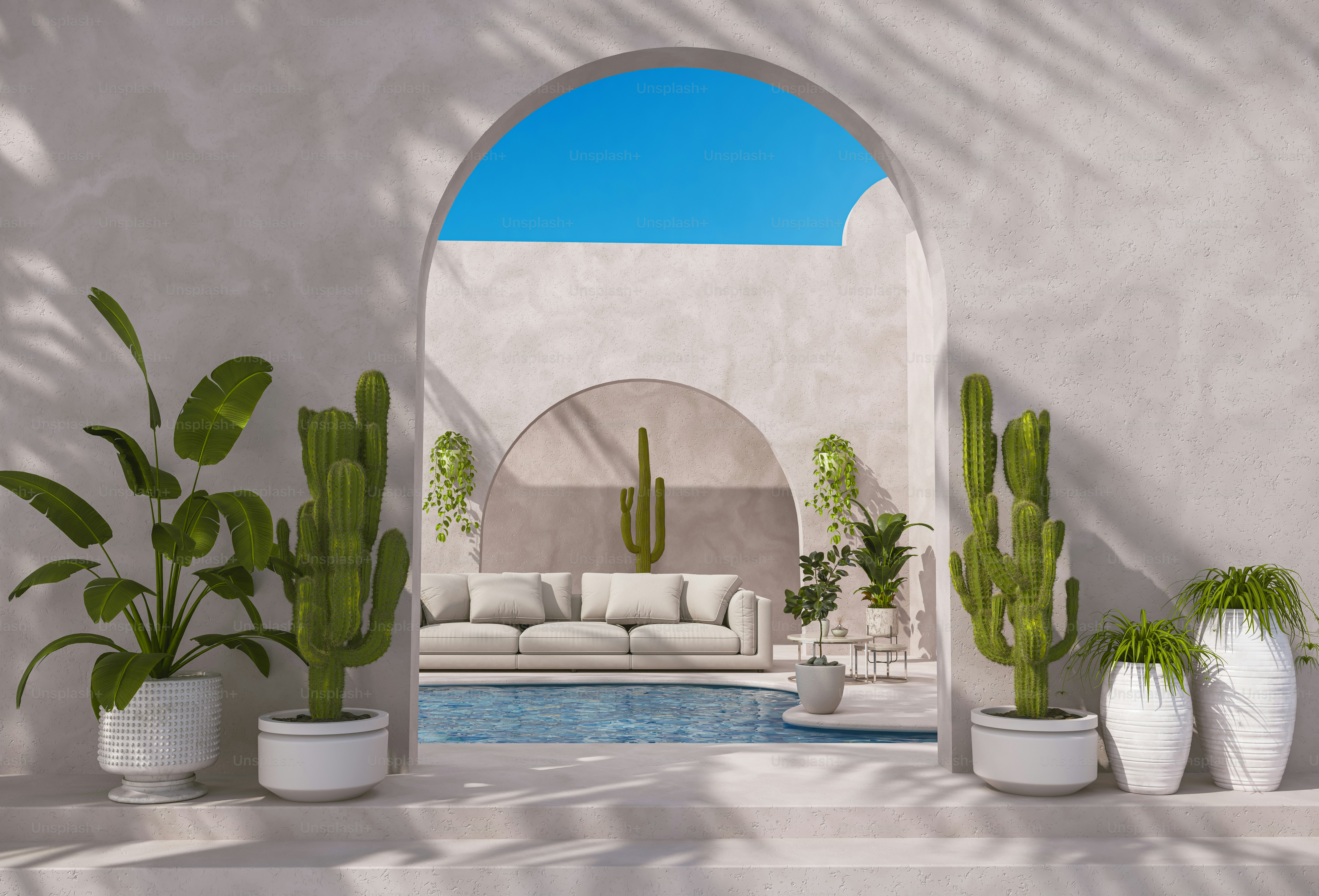 A group of potted plants sitting next to a swimming pool