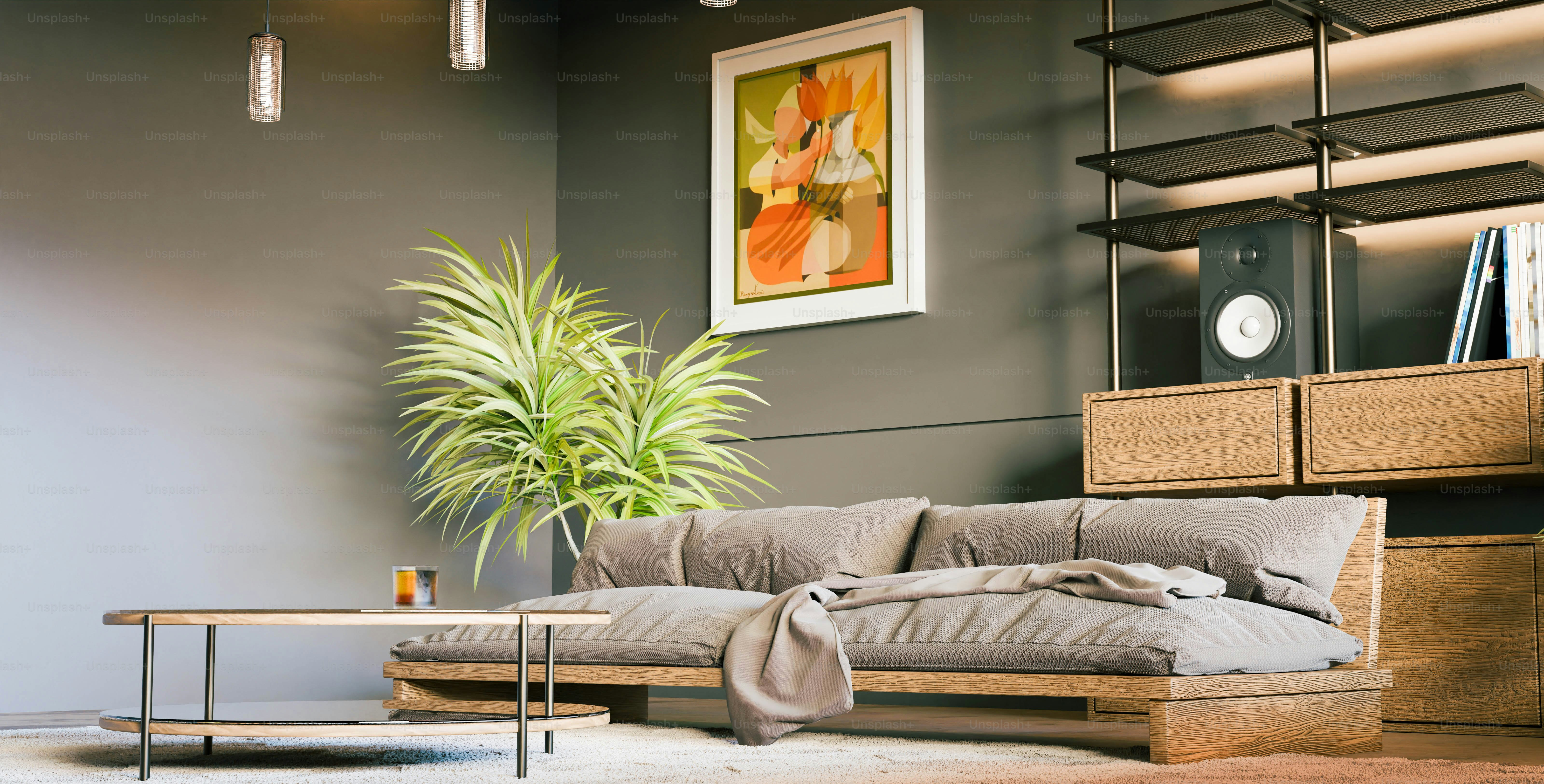 A living room with a couch a table and a plant