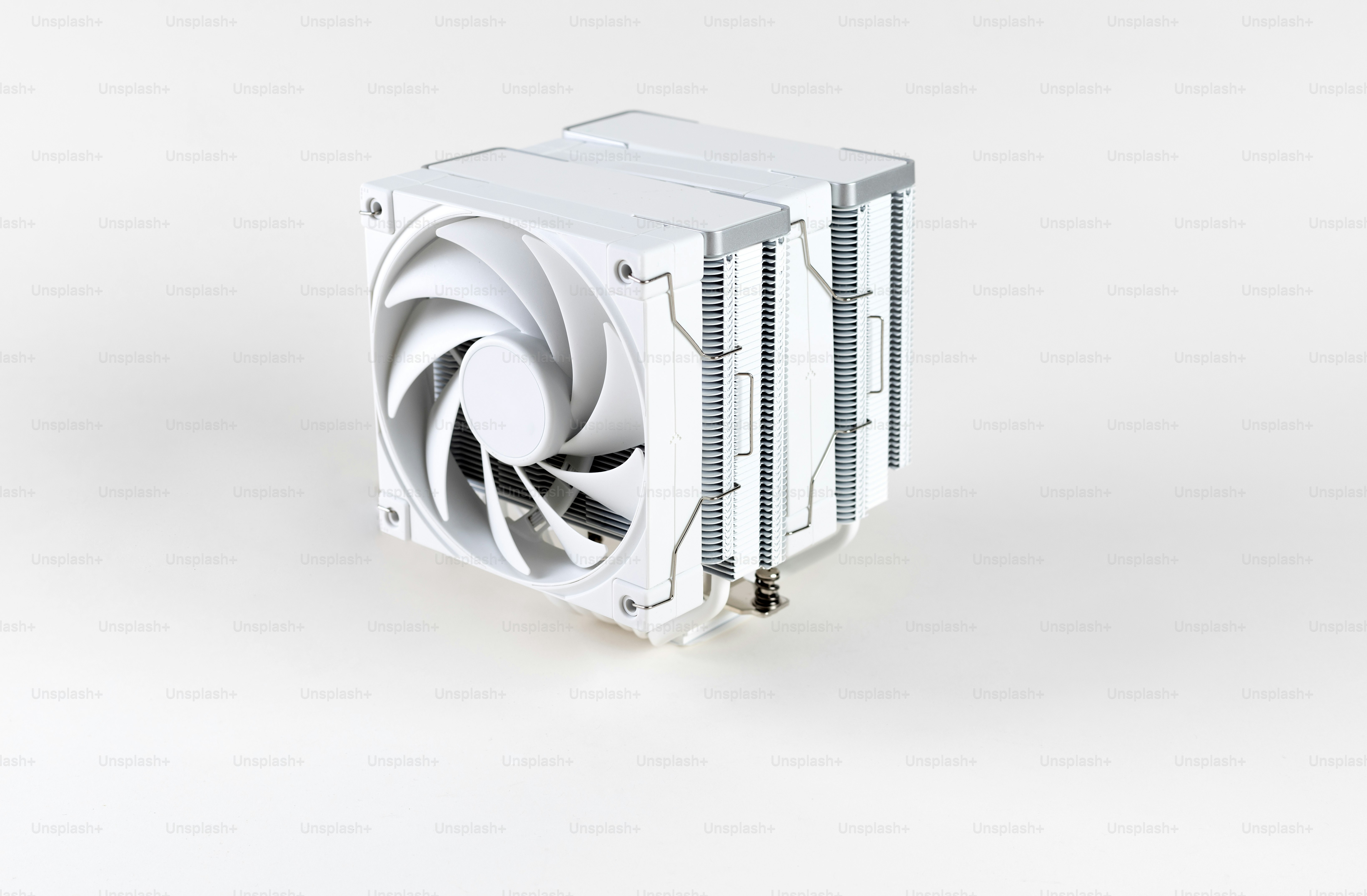 A computer fan sitting on top of a white table