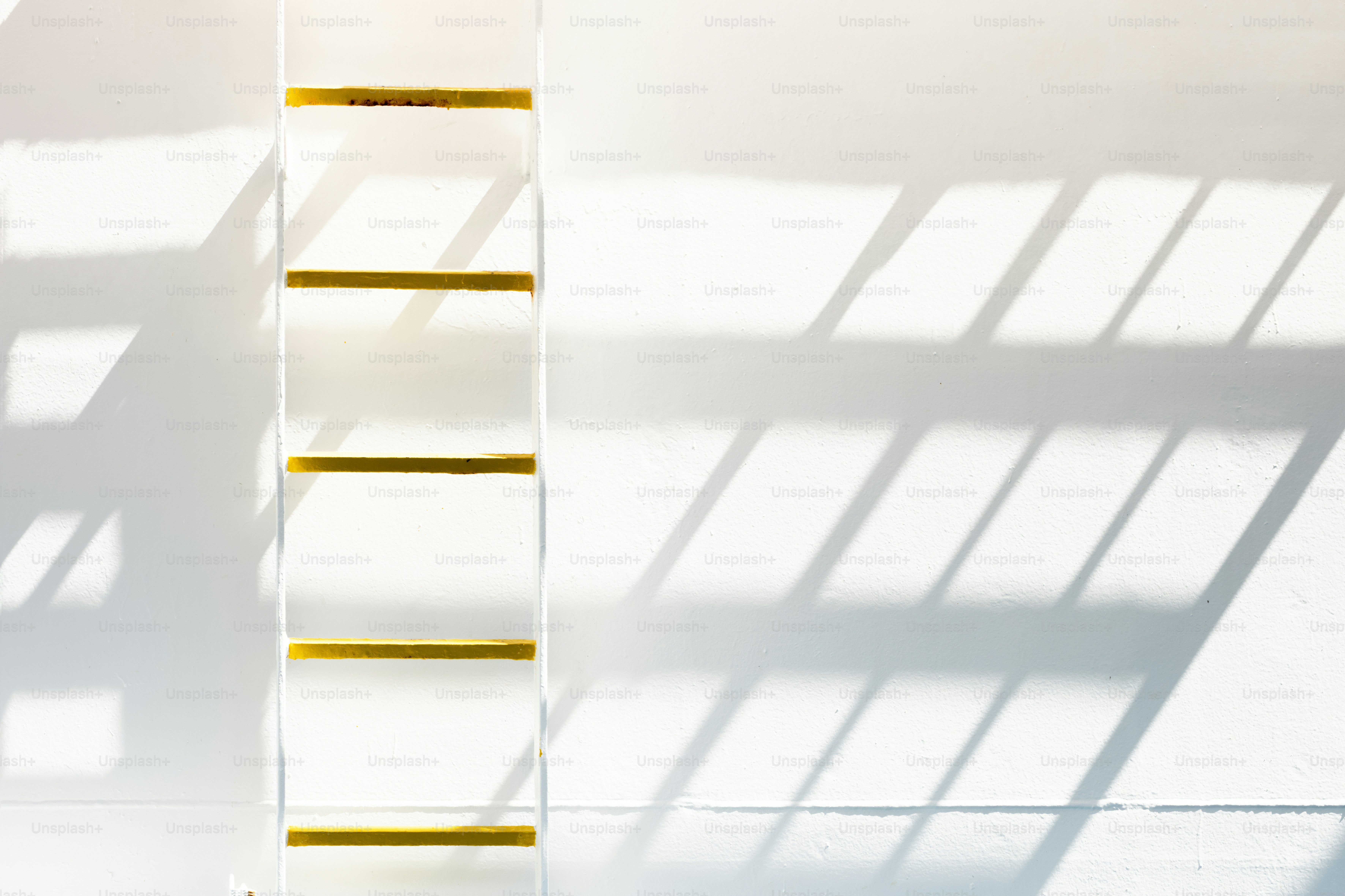 A ladder leaning against a wall in a room