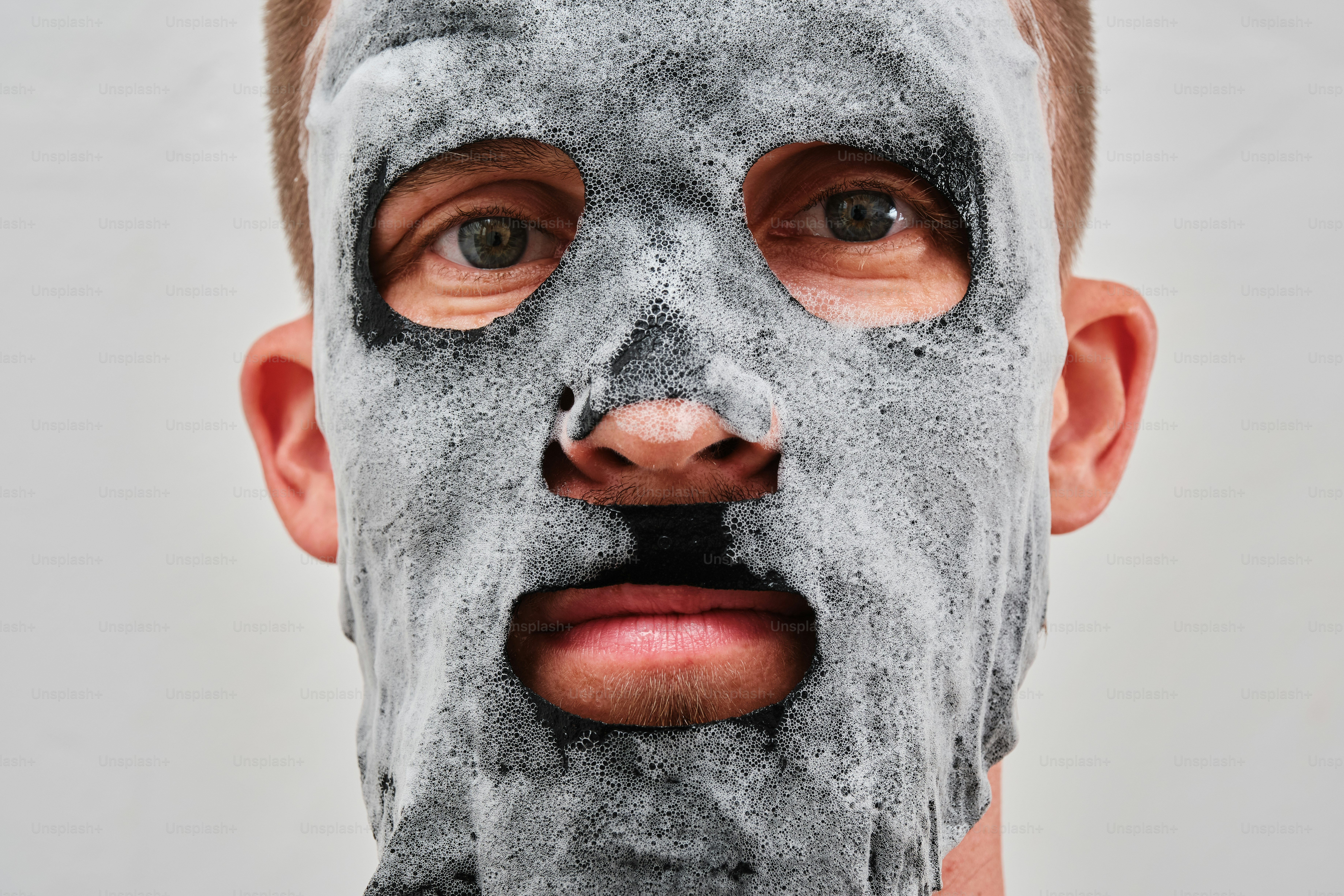 A man with a facial mask on his face
