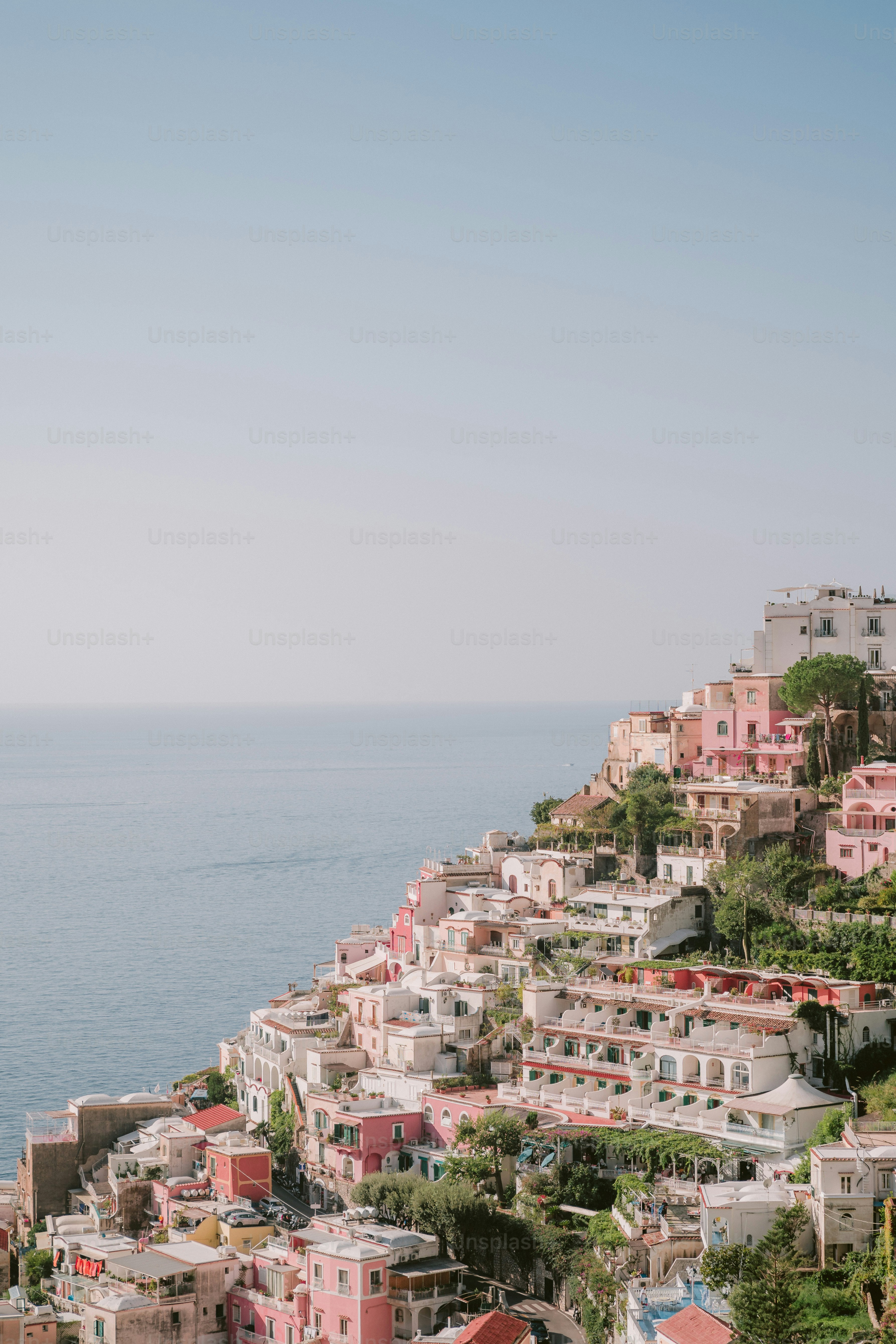 A scenic view of a city next to the ocean