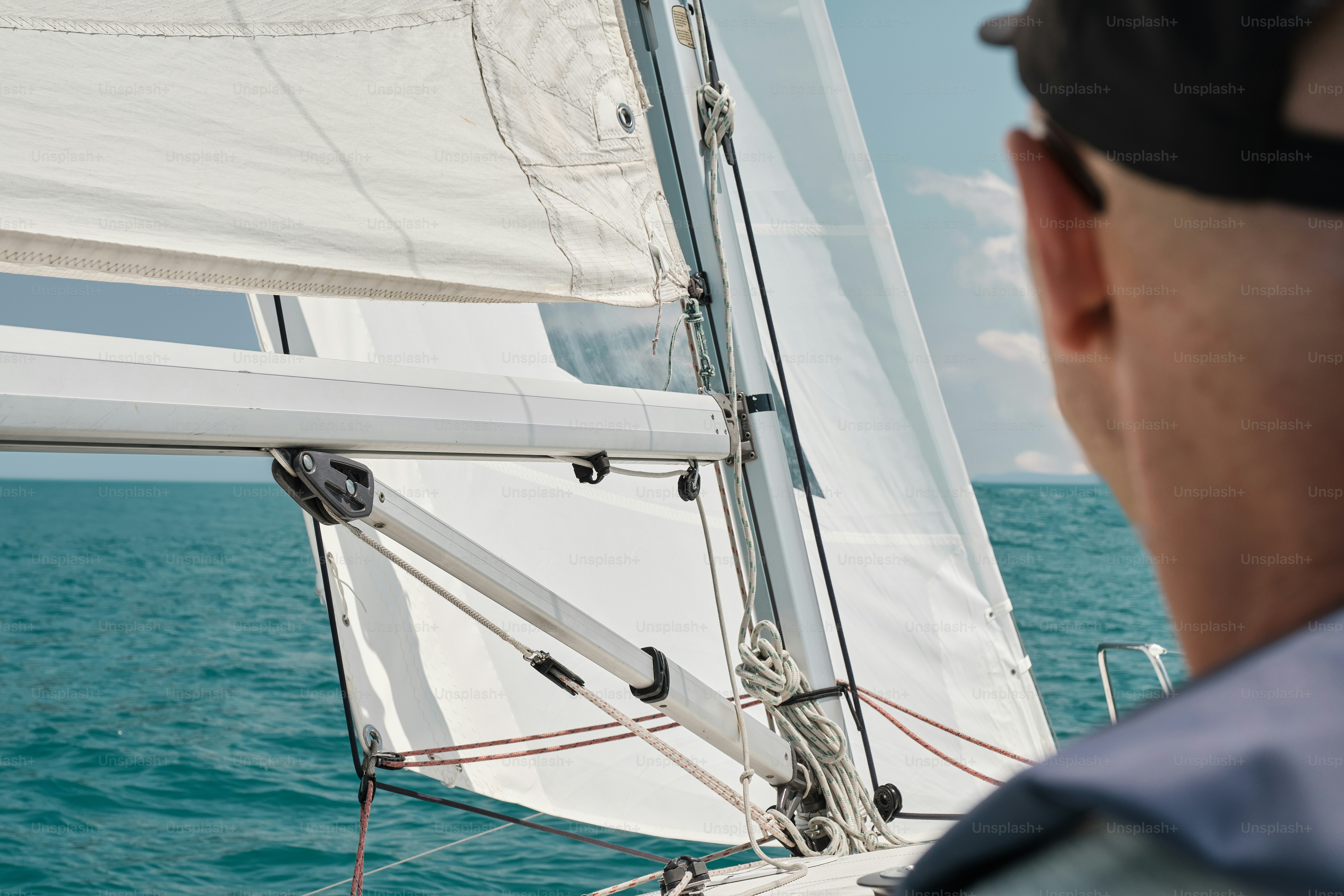 A man on a boat looking at the water