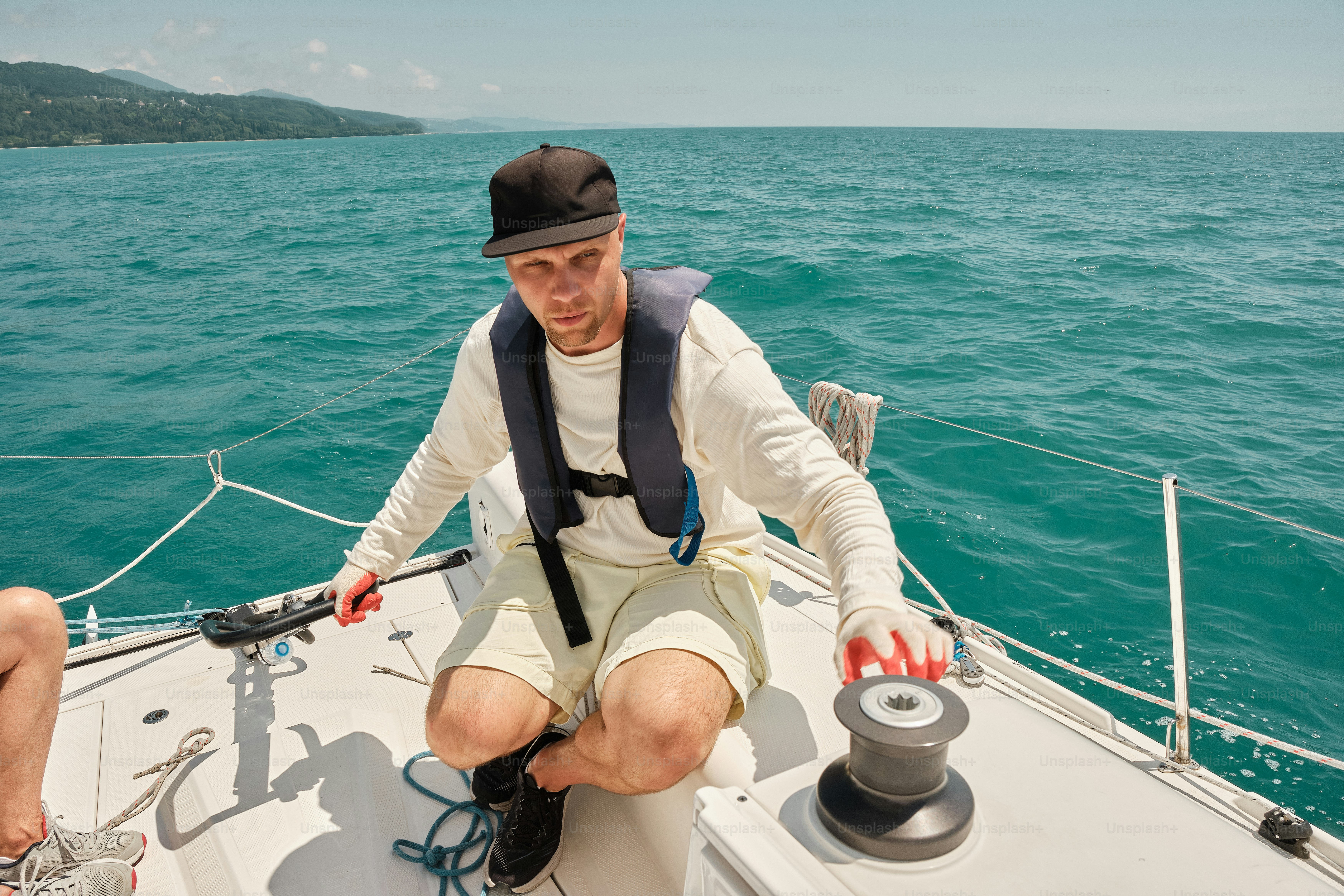 A man sitting on the bow of a boat