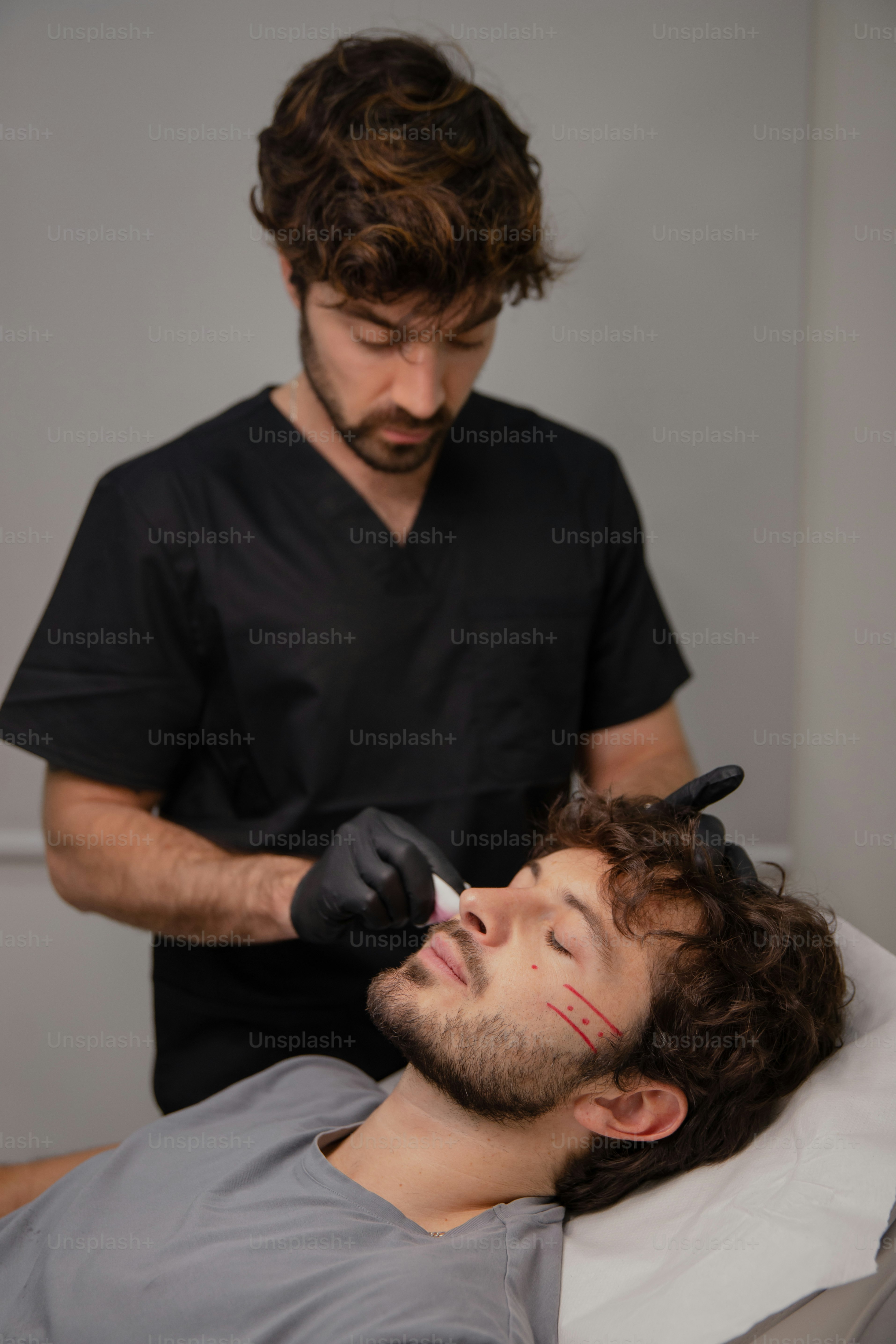 A man getting his hair cut by a hair stylist