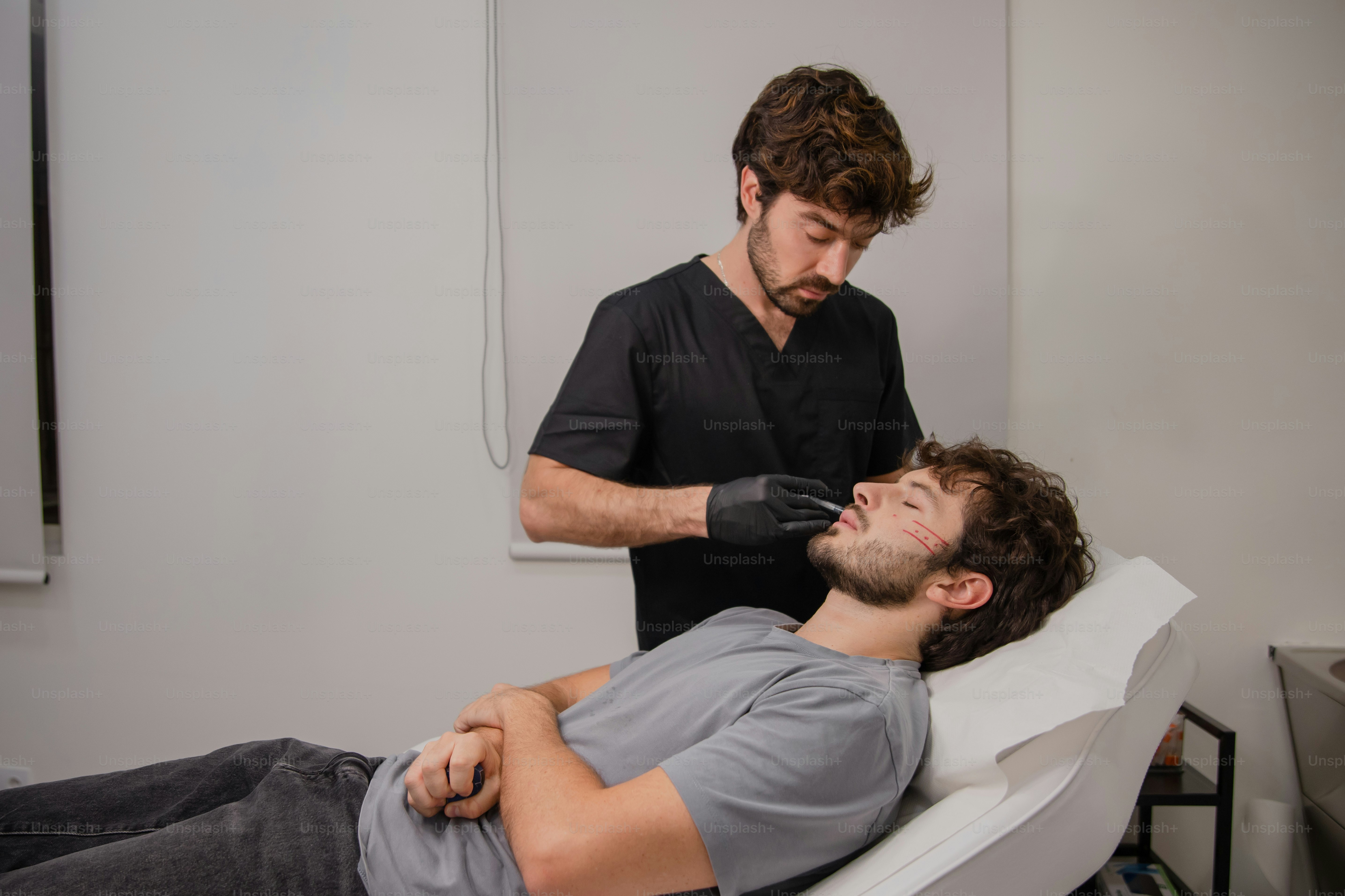 A man getting his hair cut by a hair stylist