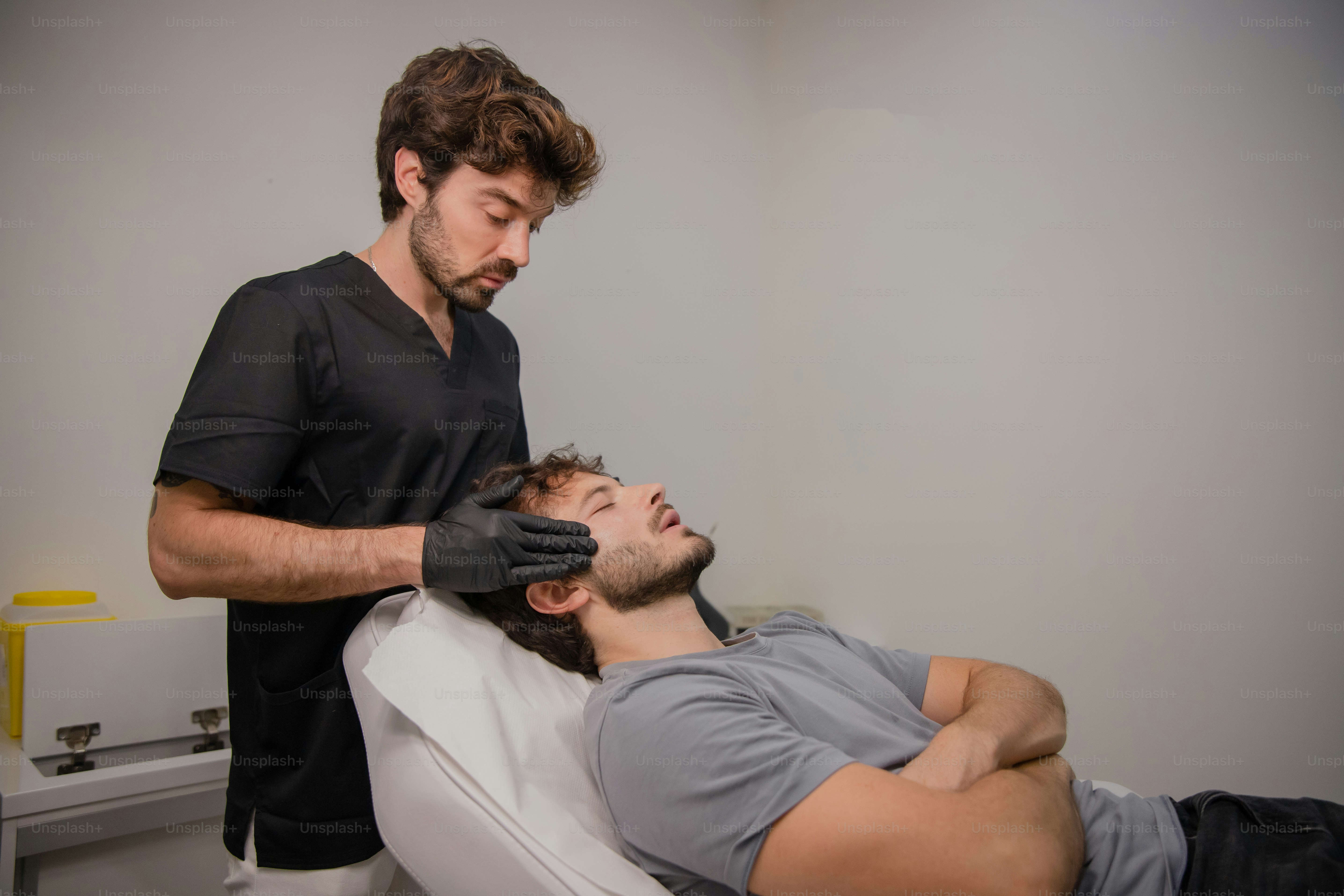 Young patient discussing beard transplant India treatment with a cosmetic surgeon