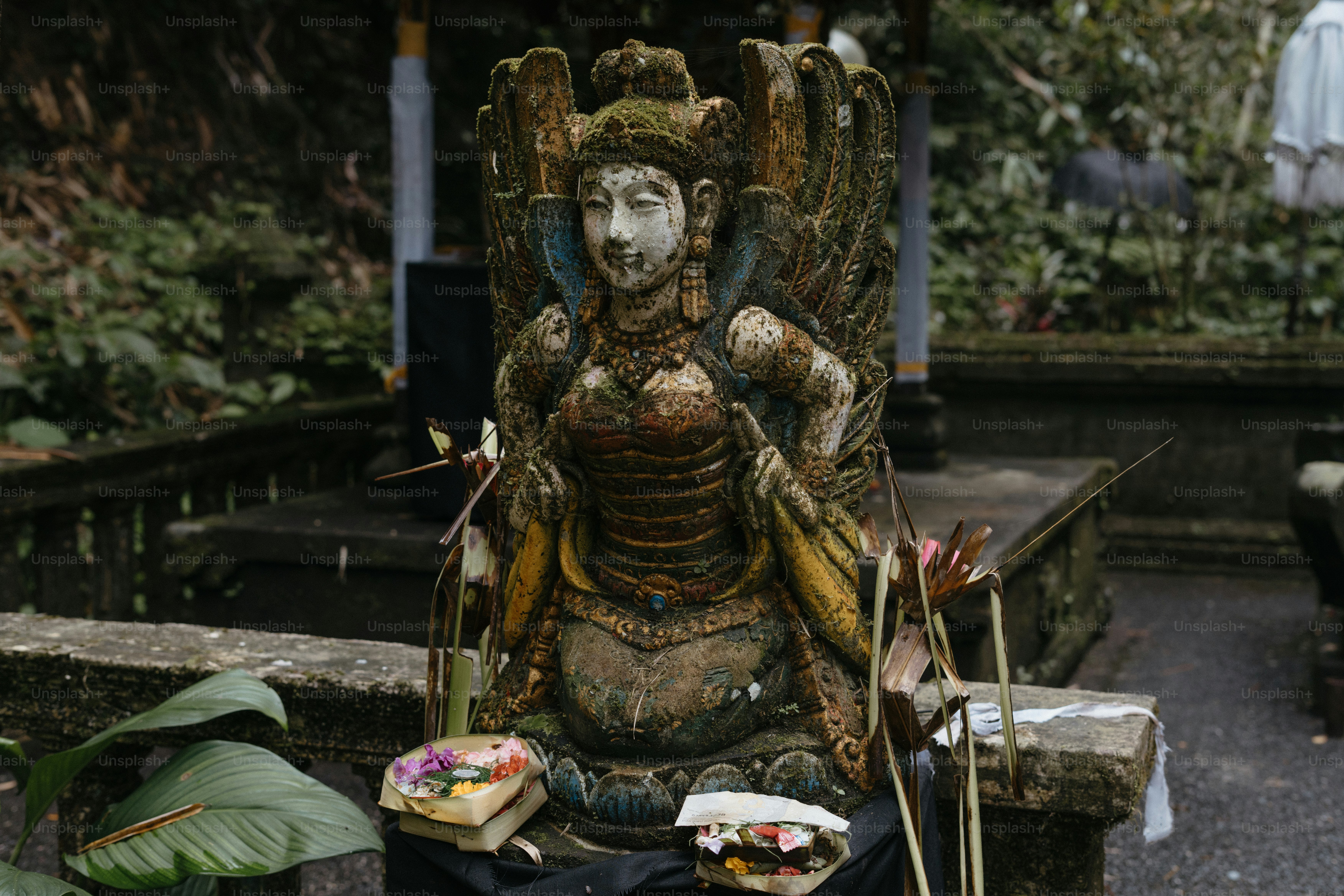 A statue of a person sitting on a bench