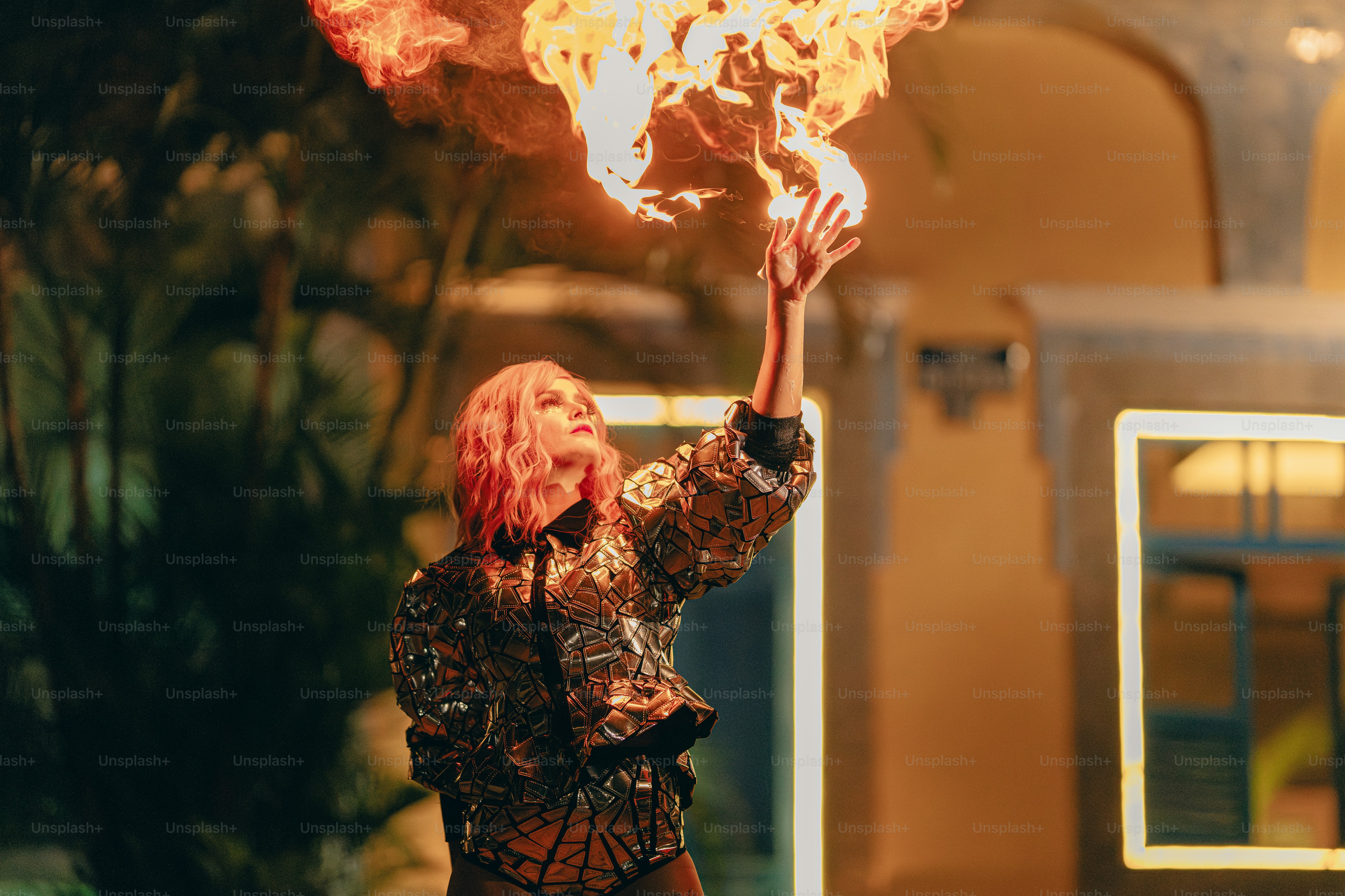 A woman holding a fire stick in her hand