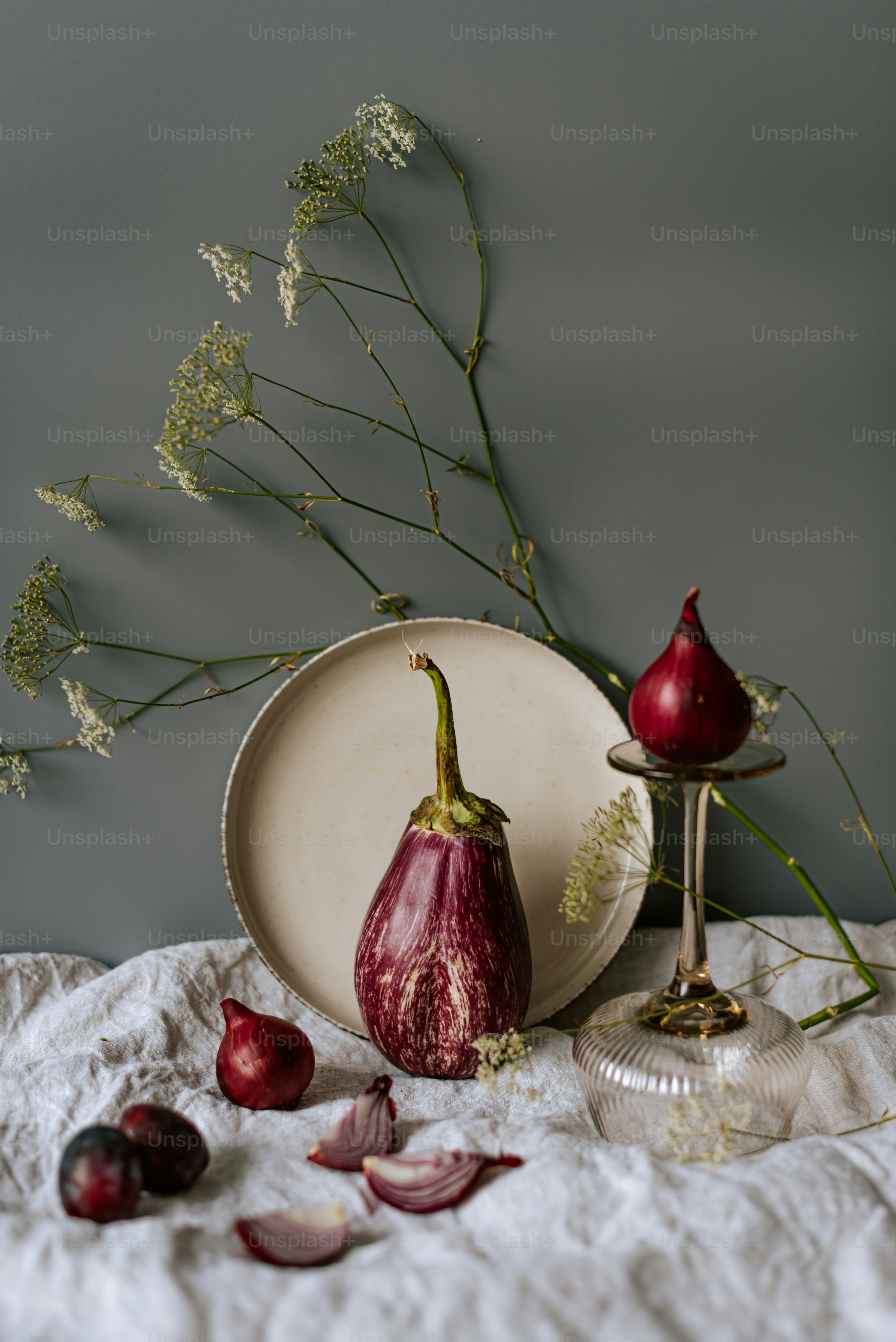 A plate with a flower and some fruit on it