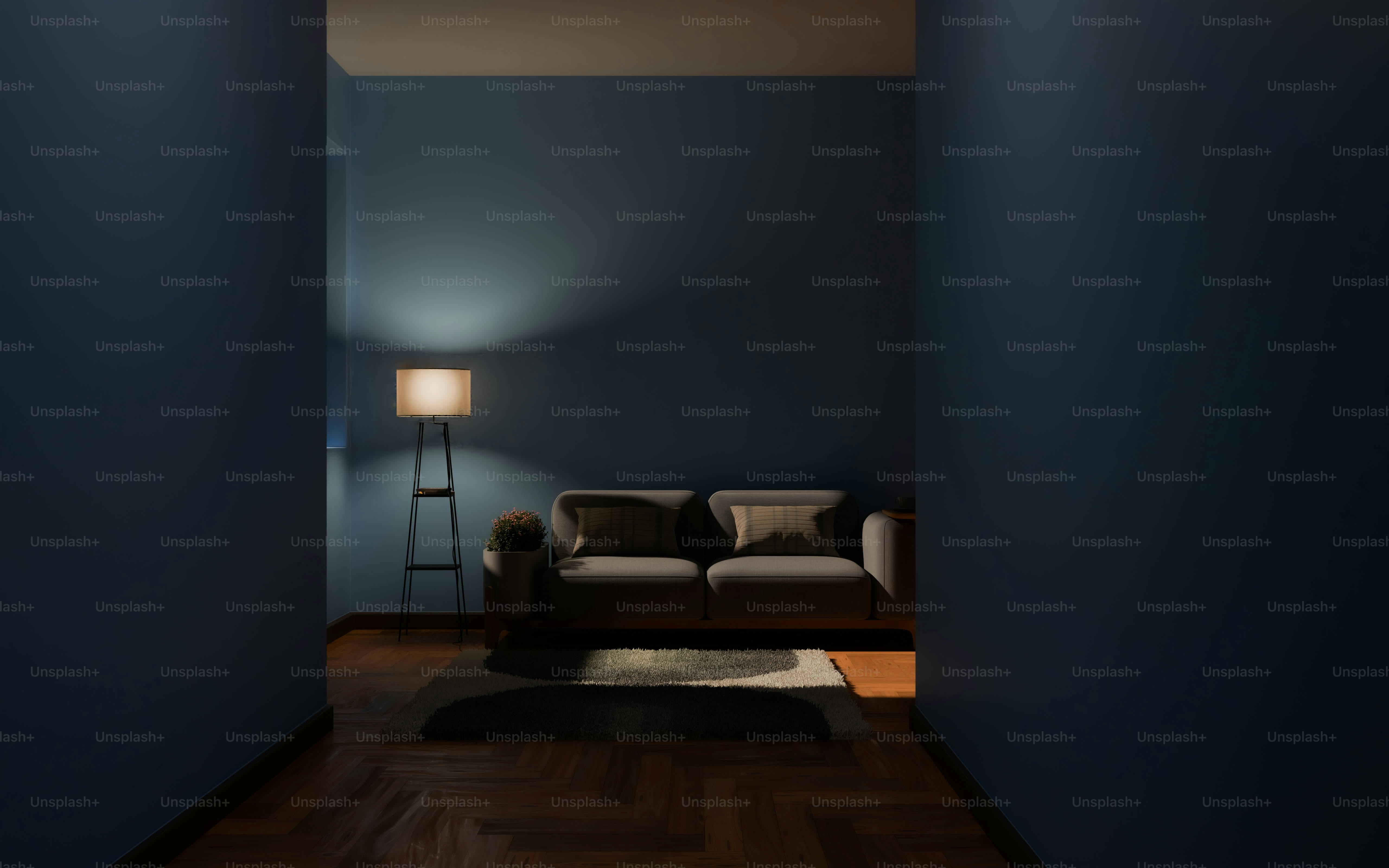 A living room with a couch and a lamp