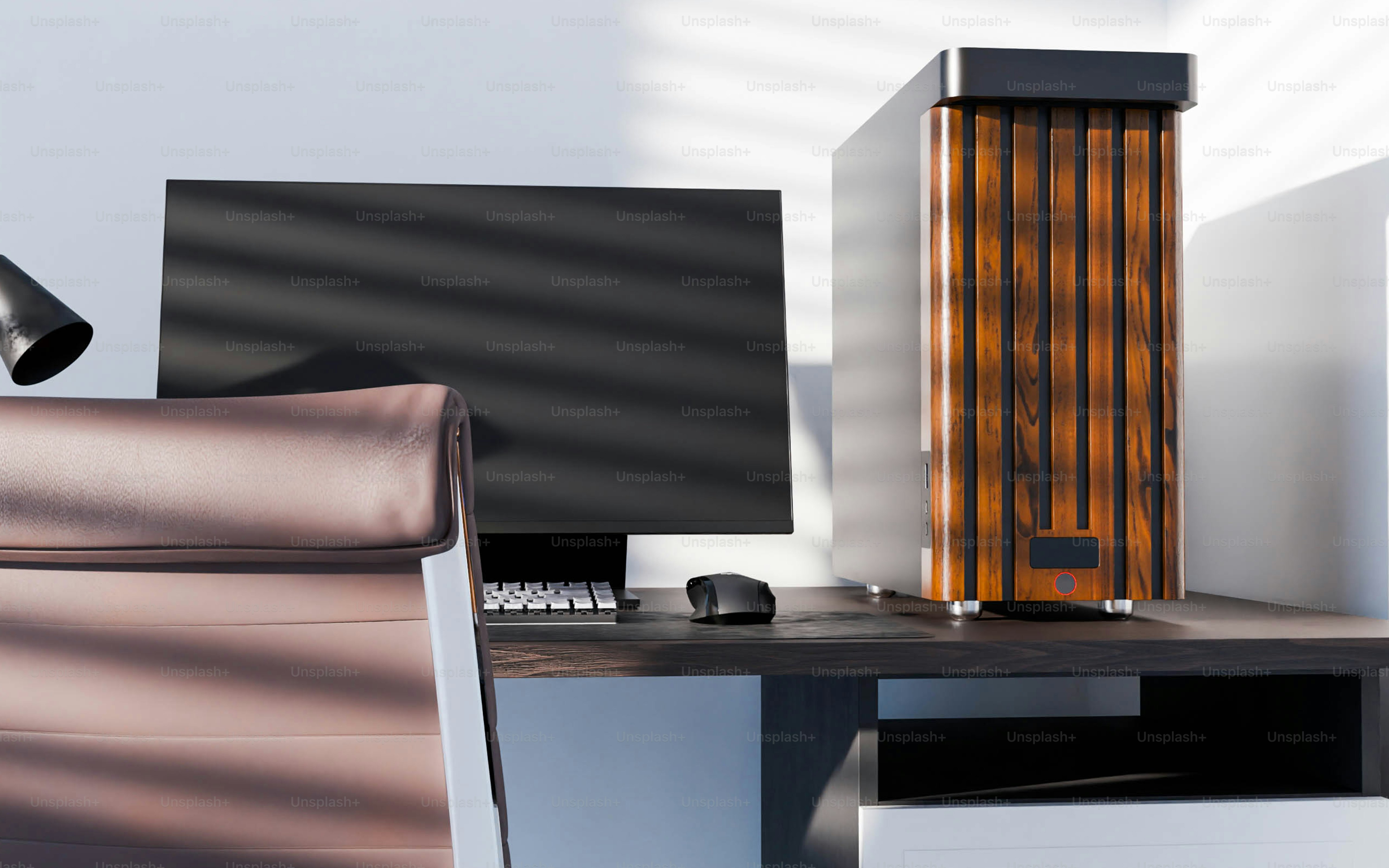 A computer desk with a monitor and a keyboard