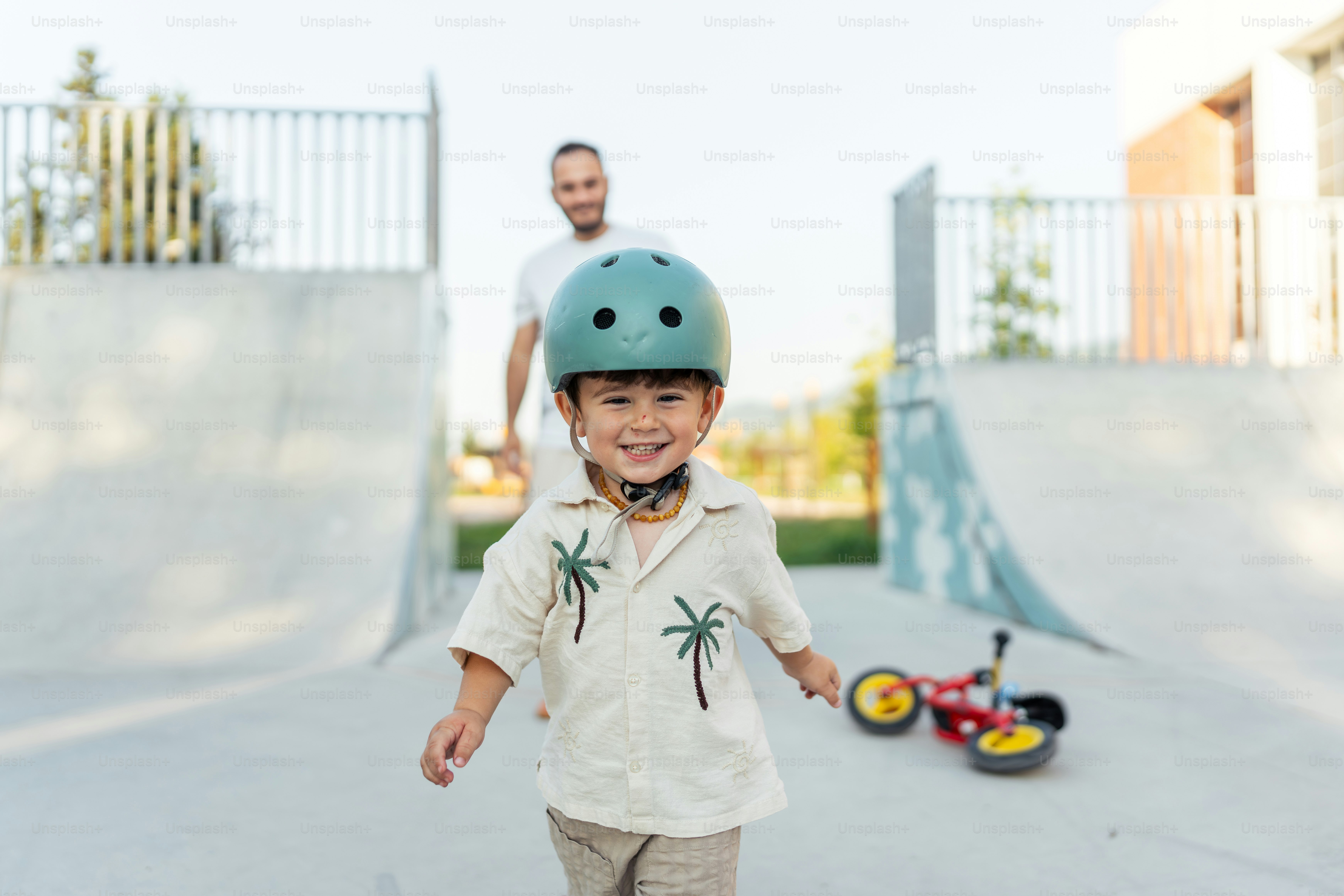 A young boy riding a skateboard at a skate park