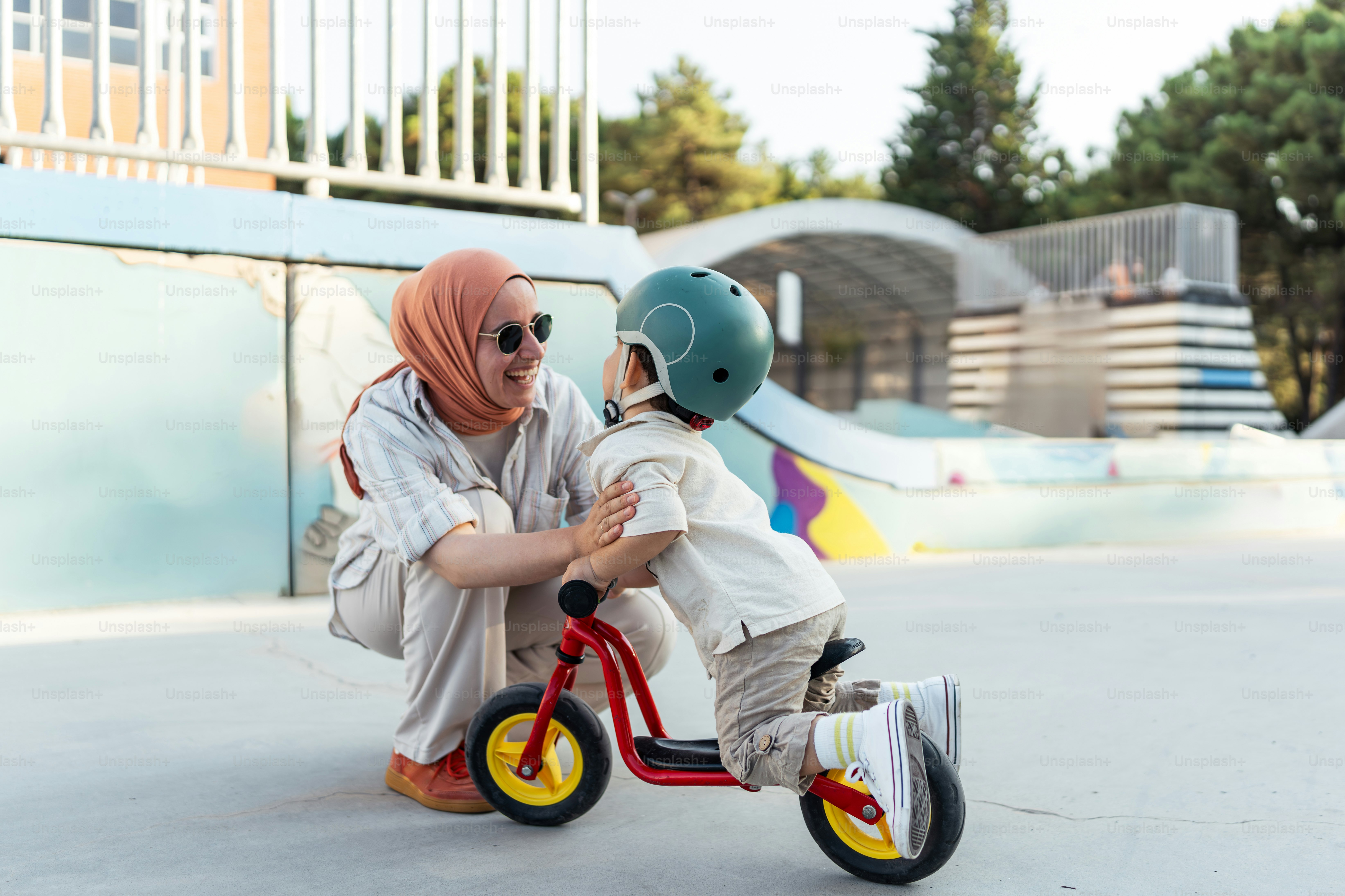 A woman and a child on a tricycle