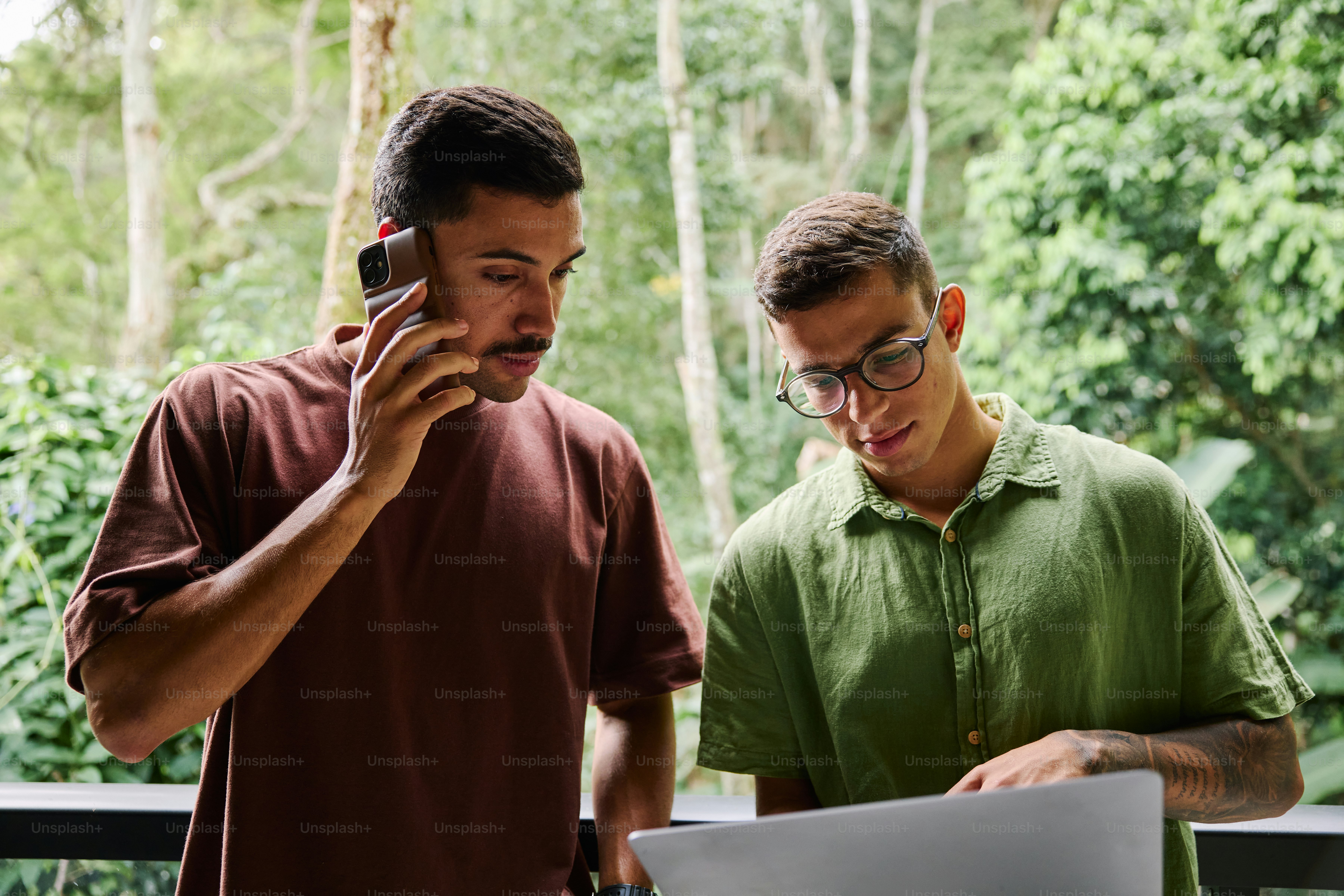 A couple of men standing next to each other