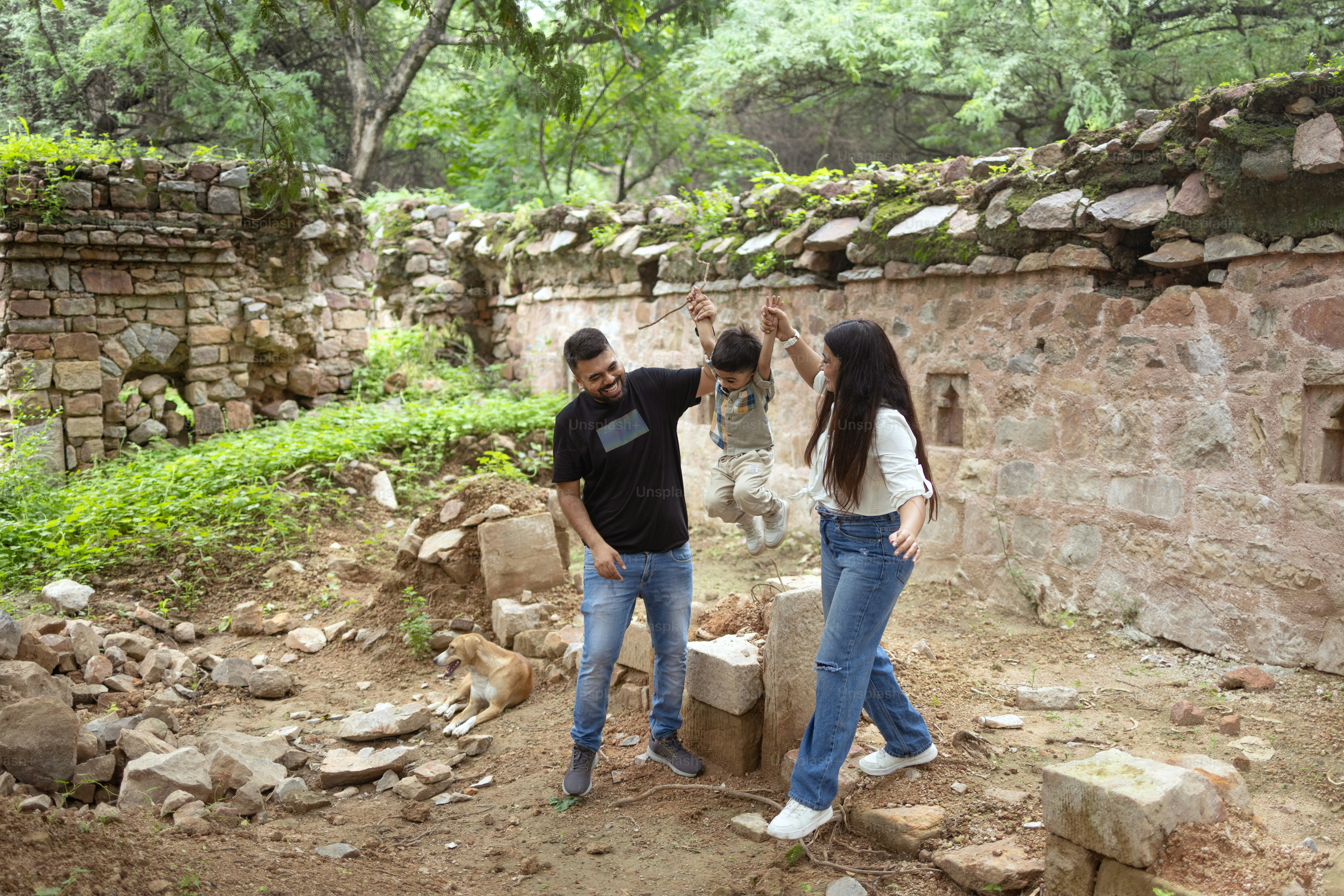 A couple of people that are standing in the dirt