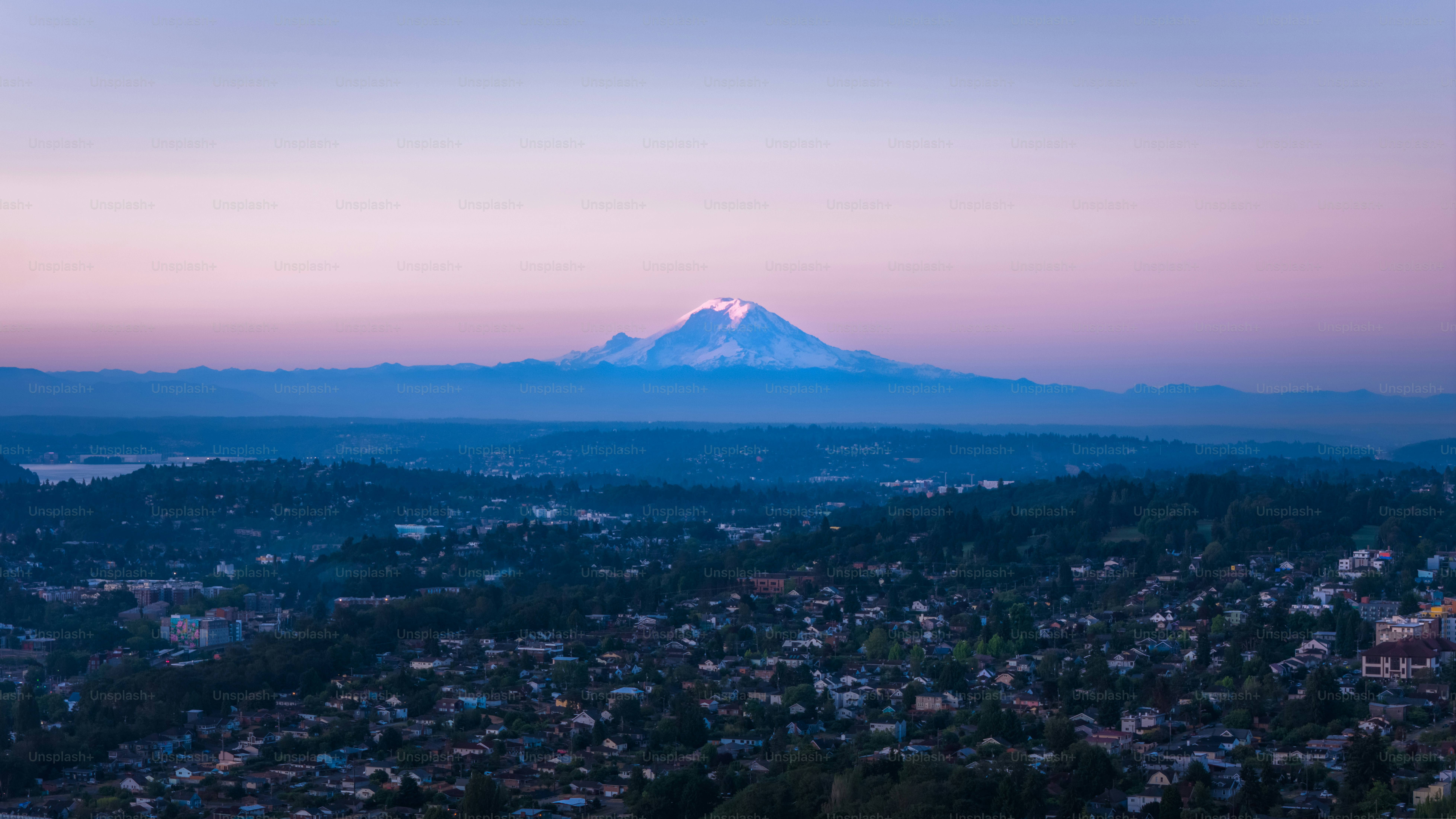 A view of a city with a mountain in the background