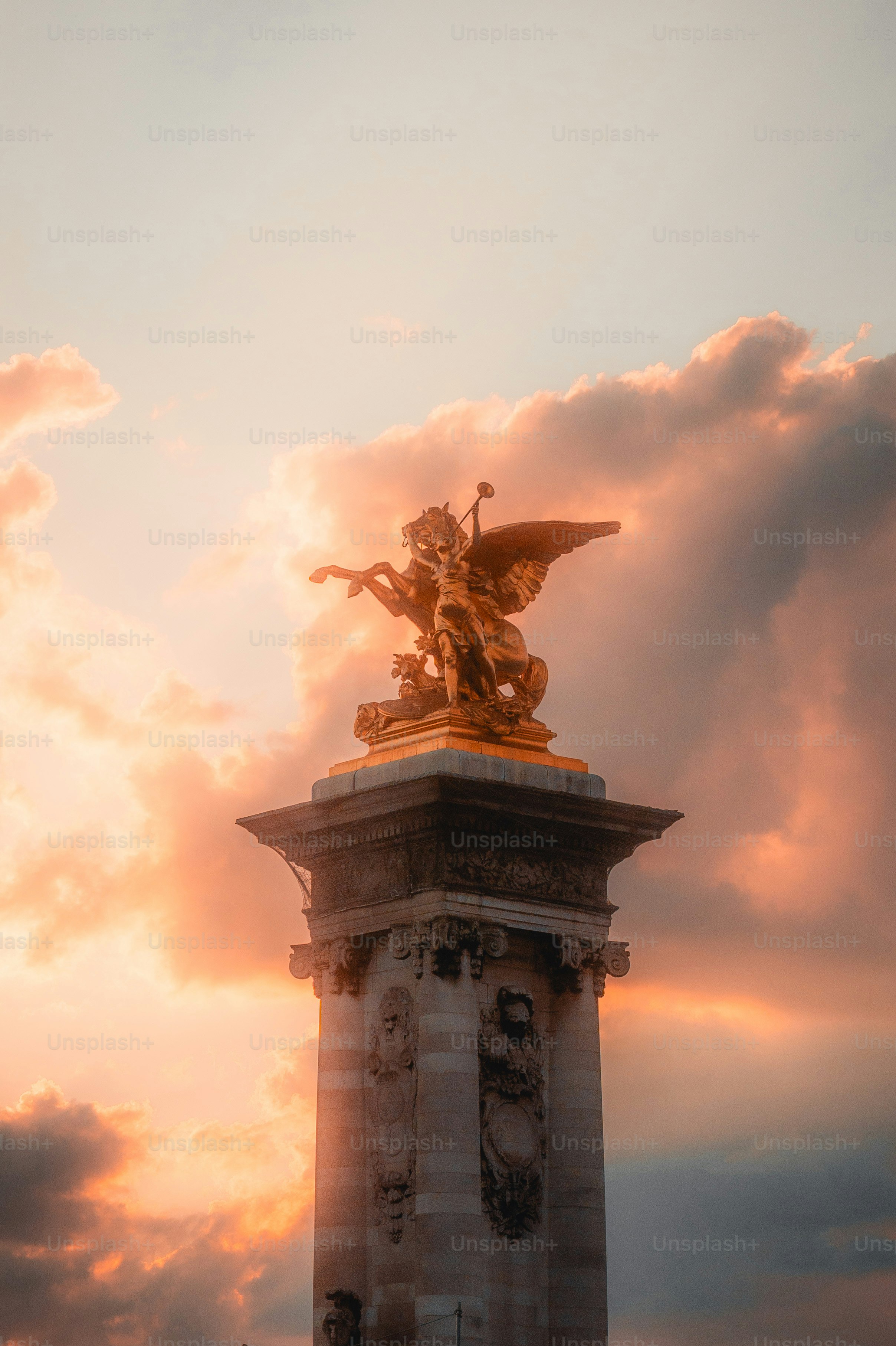 A statue of an angel on top of a pillar