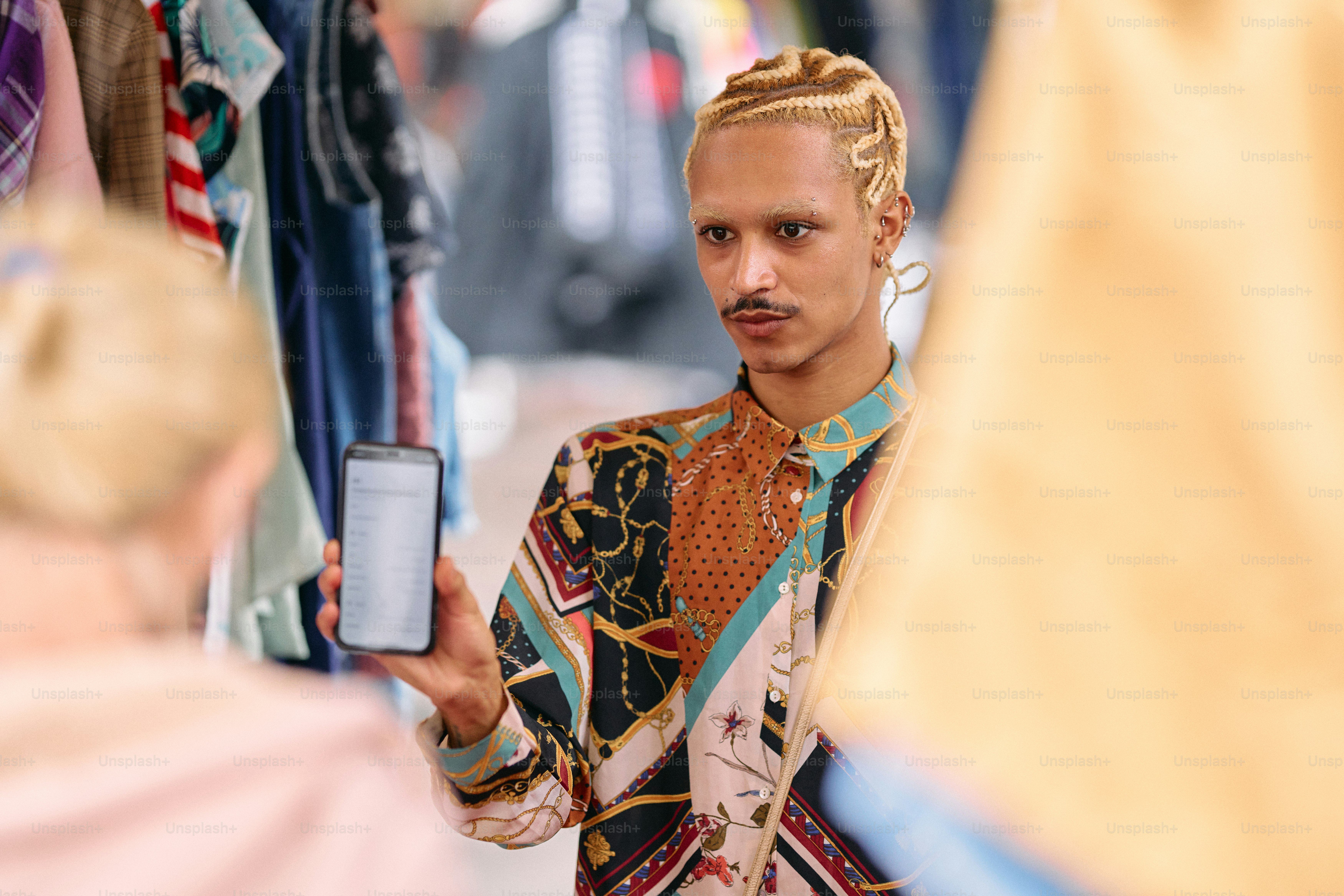 A man holding a smart phone in his hand