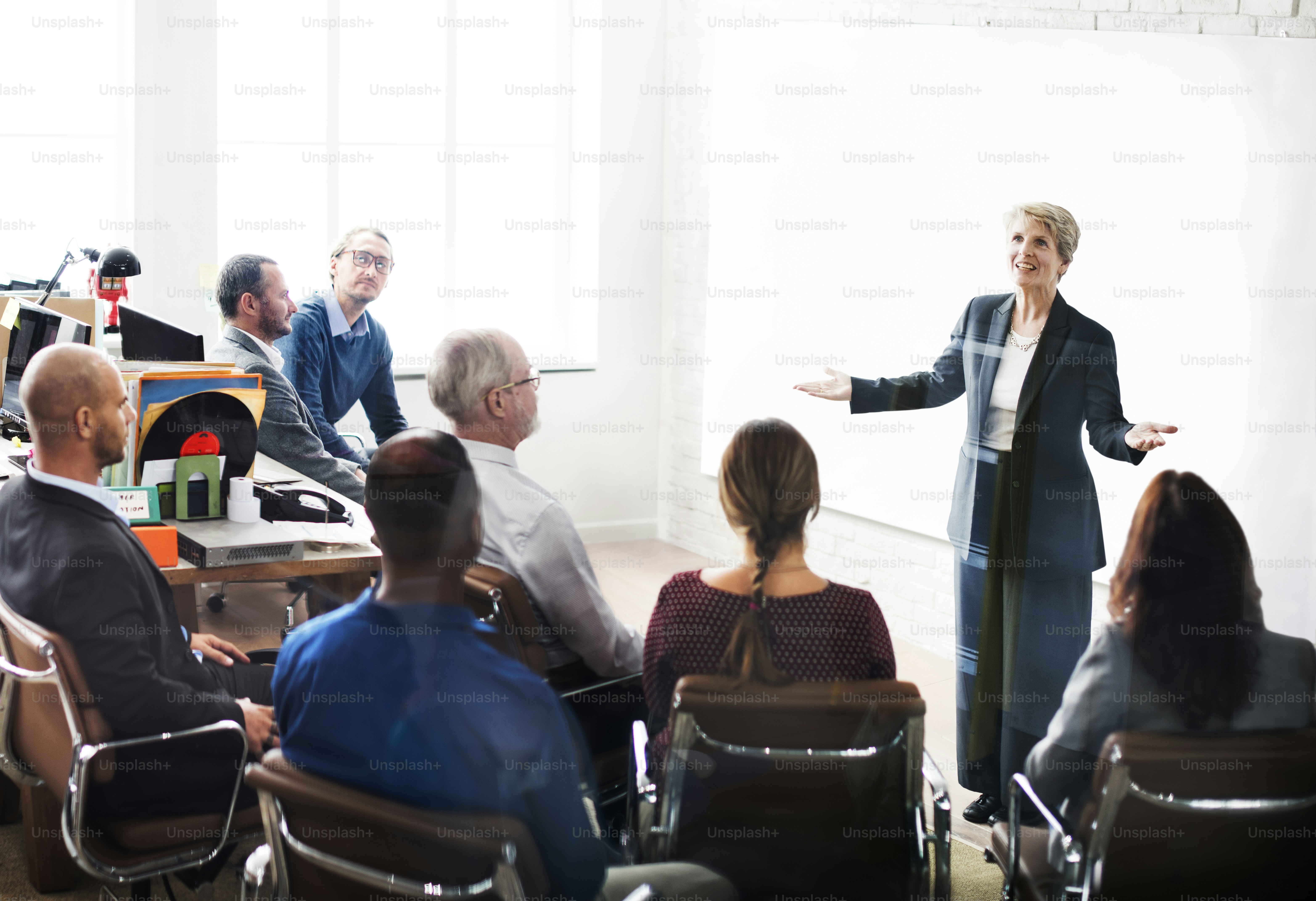 Senior care HIPAA training session with assisted living caregivers reviewing resident privacy procedures
