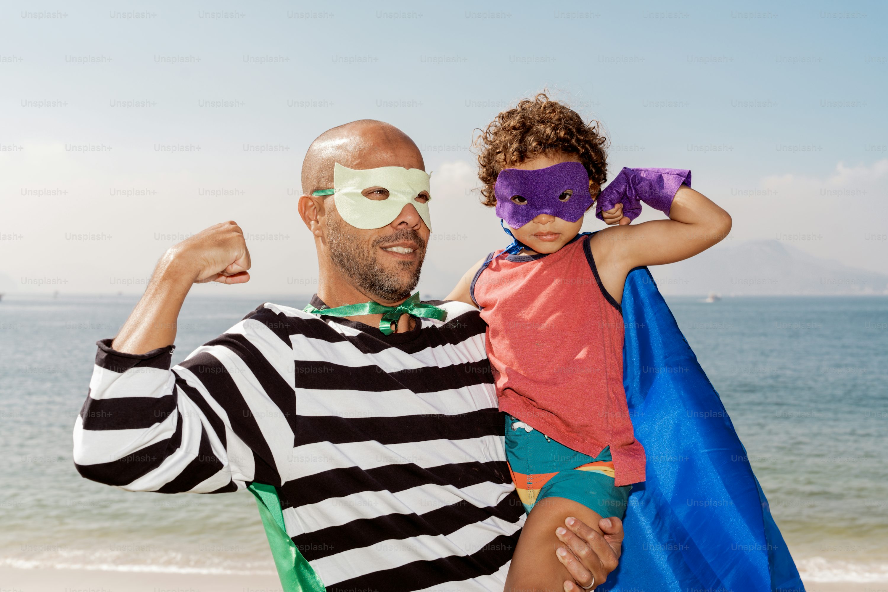 A man and a little girl on the beach