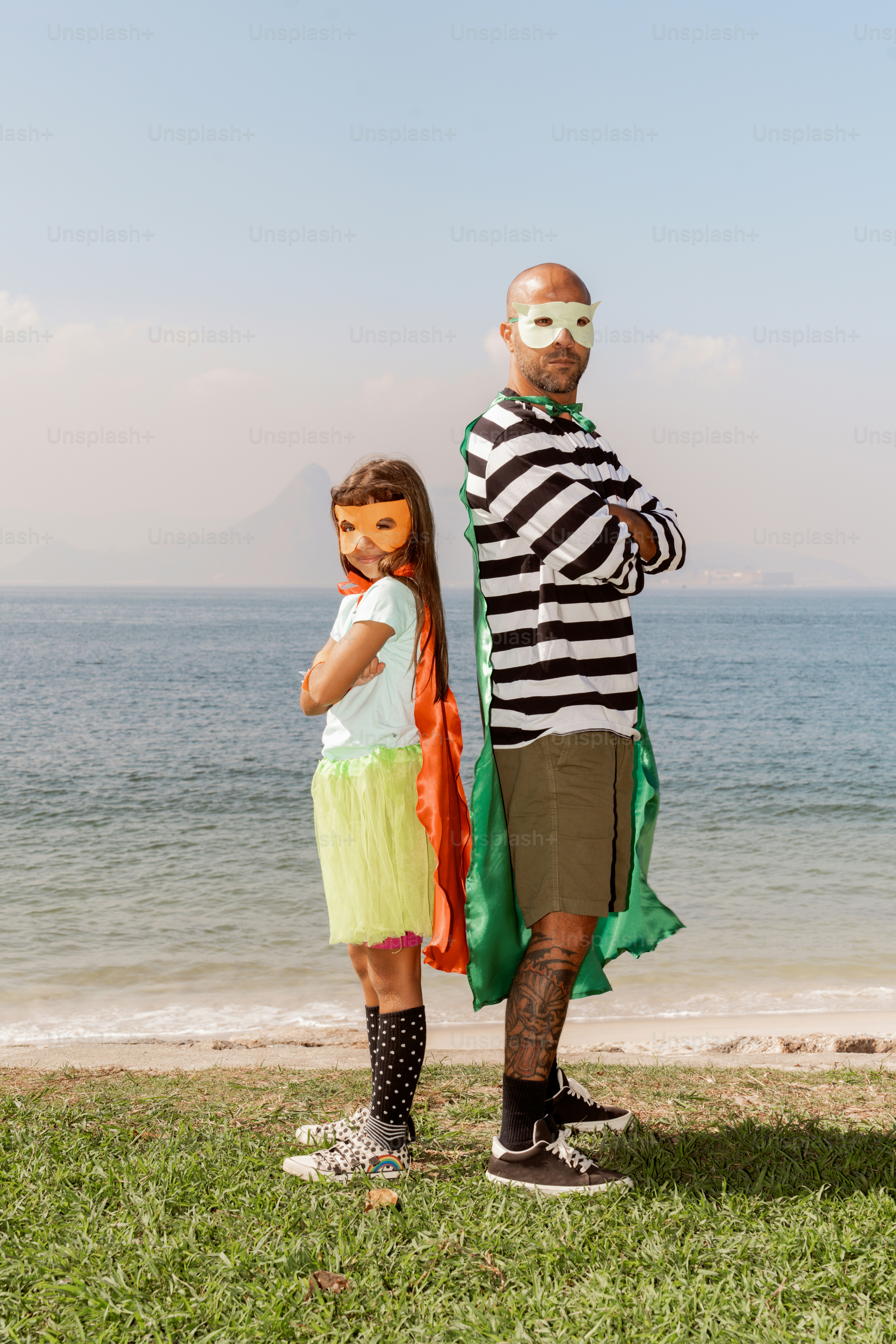 A man and a little girl standing next to each other