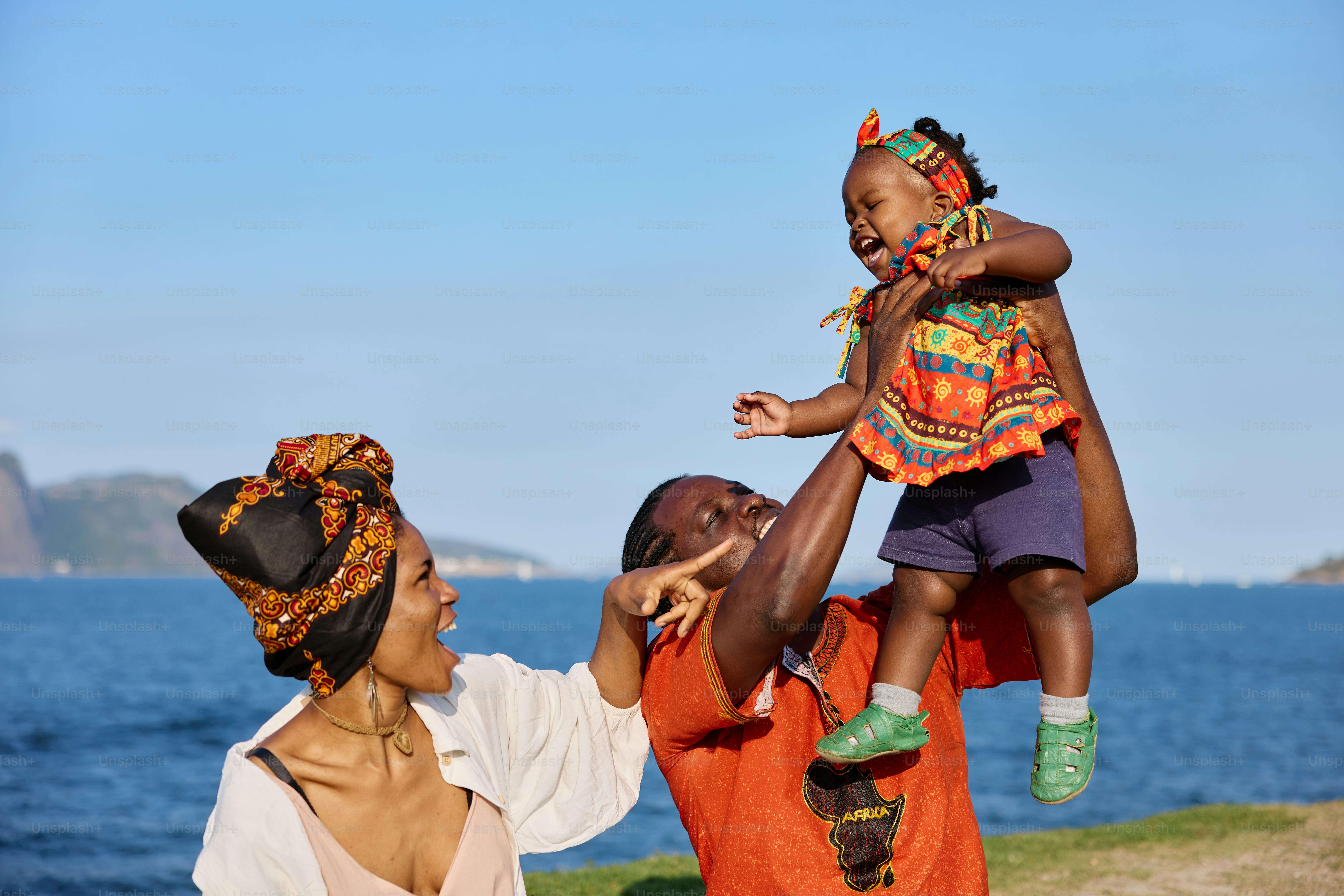 A woman holding a child on her shoulders